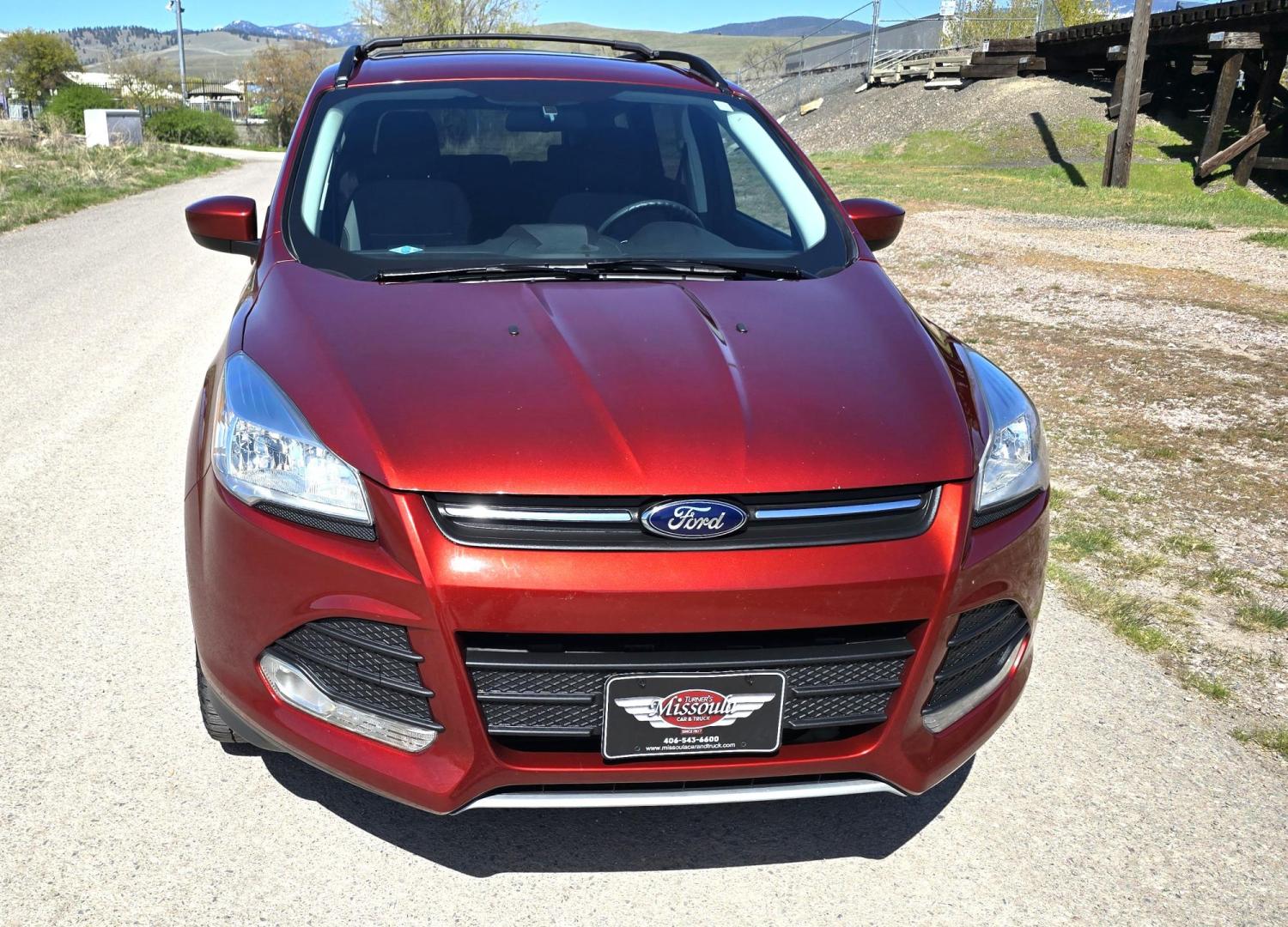 2014 Orange /Gray Ford Escape SE 4WD (1FMCU9G94EU) with an 2.0L L4 DOHC 16V engine, 6-Speed Automatic transmission, located at 450 N Russell, Missoula, MT, 59801, (406) 543-6600, 46.874496, -114.017433 - Beautiful Ford Escape. AWD. Official Color is Sunset Metallic. 2.0L I4 Engine. Automatic Transmission. Air. Cruise. Tilt. Bluetooth Audio and Phone. Backup Camera. Power Windows and Locks. AM FM SAT CD Player. Roof Rack. Towing. - Photo#4