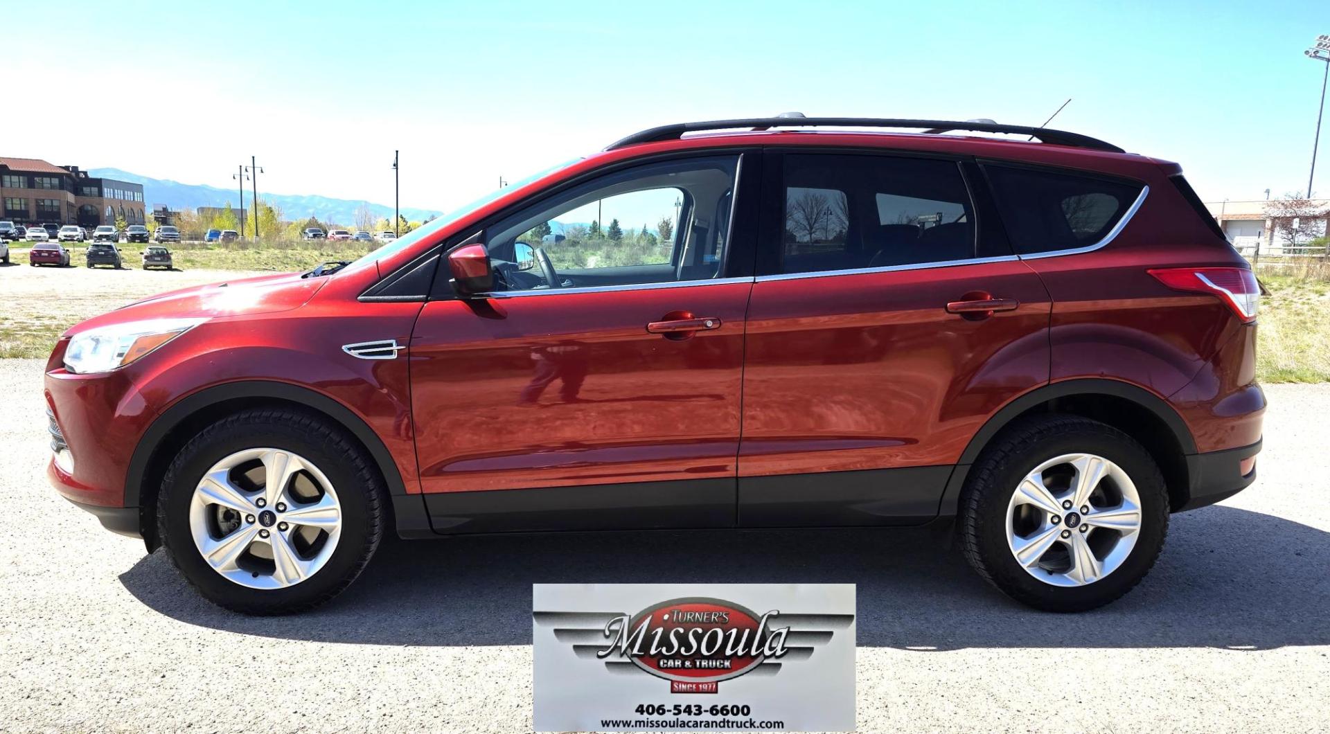 2014 Orange /Gray Ford Escape SE 4WD (1FMCU9G94EU) with an 2.0L L4 DOHC 16V engine, 6-Speed Automatic transmission, located at 450 N Russell, Missoula, MT, 59801, (406) 543-6600, 46.874496, -114.017433 - Beautiful Ford Escape. AWD. Official Color is Sunset Metallic. 2.0L I4 Engine. Automatic Transmission. Air. Cruise. Tilt. Bluetooth Audio and Phone. Backup Camera. Power Windows and Locks. AM FM SAT CD Player. Roof Rack. Towing. - Photo#2