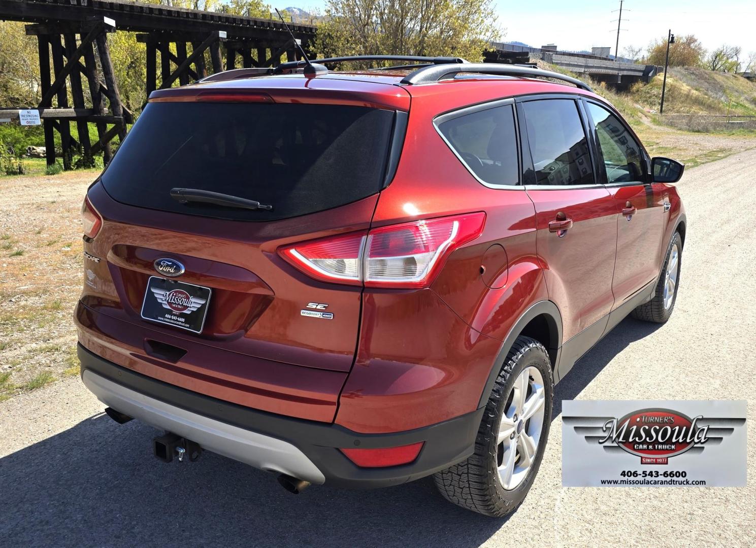 2014 Orange /Gray Ford Escape SE 4WD (1FMCU9G94EU) with an 2.0L L4 DOHC 16V engine, 6-Speed Automatic transmission, located at 450 N Russell, Missoula, MT, 59801, (406) 543-6600, 46.874496, -114.017433 - Beautiful Ford Escape. AWD. Official Color is Sunset Metallic. 2.0L I4 Engine. Automatic Transmission. Air. Cruise. Tilt. Bluetooth Audio and Phone. Backup Camera. Power Windows and Locks. AM FM SAT CD Player. Roof Rack. Towing. - Photo#9