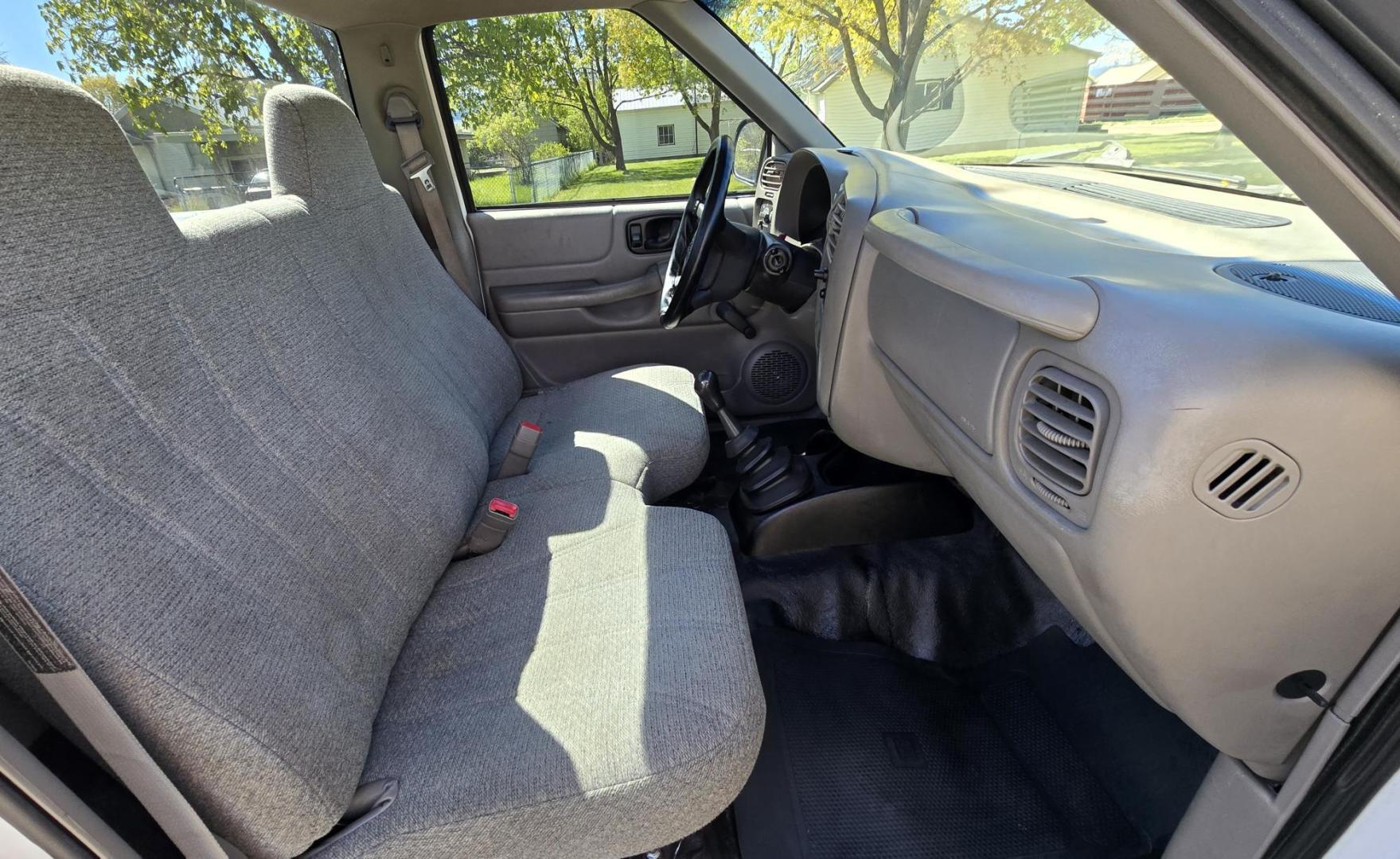1999 White /Black Chevrolet S10 Pickup Short Bed 2WD (1GCCS1448X8) with an 2.2L L4 OHV 8V engine, 5 Speed Manual transmission, located at 450 N Russell, Missoula, MT, 59801, (406) 543-6600, 46.874496, -114.017433 - Cute Little 2WD Truck. Odometer doesn't work so we don't know the miles. Runs great with an economical 2.2L I4 Engine. 5 Speed Manual Transmission. Air Conditioning. AM FM CD Player. Bed Cover. Towing Receiver Hitch. Financing is Not Available through our lenders. - Photo#7