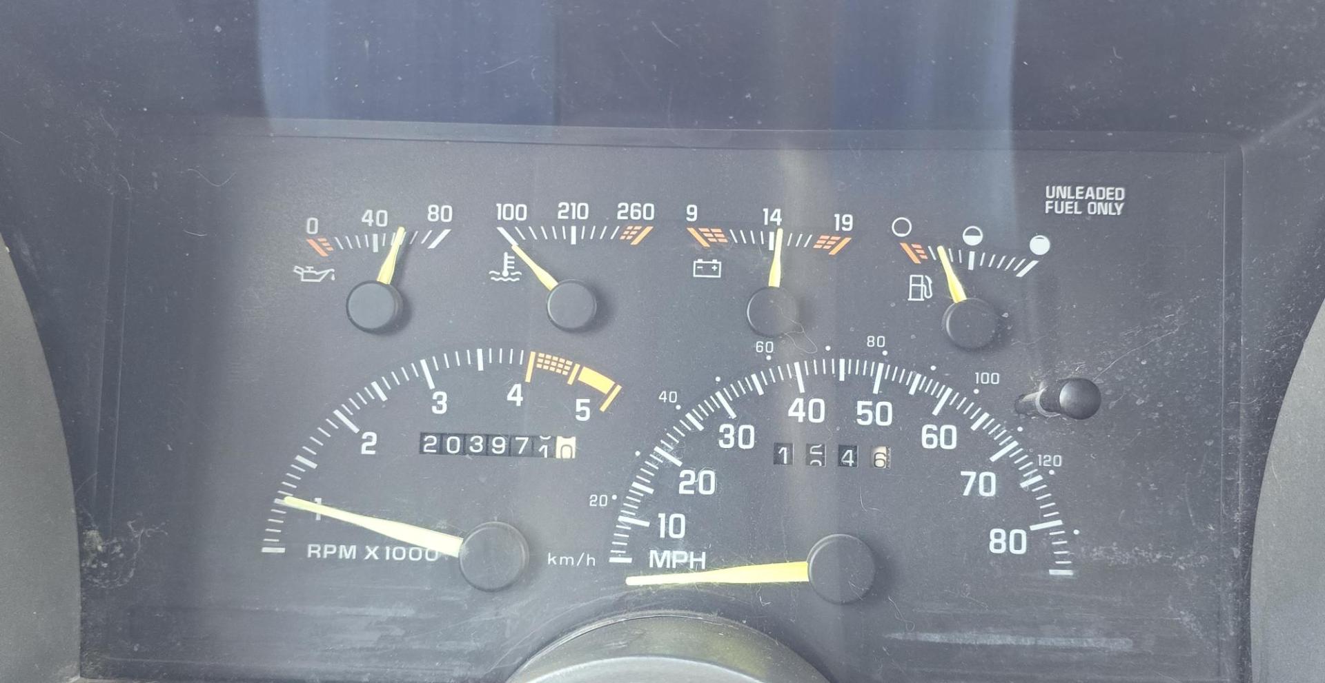 1994 Blue /Blue Chevrolet C/K 1500 Ext. Cab 6.5-ft. Bed 4WD (1GCEK19K5RE) with an 5.7L V8 OHV 16V engine, 5 Speed Manual transmission, located at 450 N Russell, Missoula, MT, 59801, (406) 543-6600, 46.874496, -114.017433 - 4WD. Extended Cab. 5.7L V8. 5 Speed Manual Transmission. Air. Cruise. Tilt. Power Windows and Locks. Matching Topper. Paint is a little rough and and a couple rust spots. Lots of miles but runs amazing. Because of the age our Lenders do not offer financing on this vehicle. - Photo#12