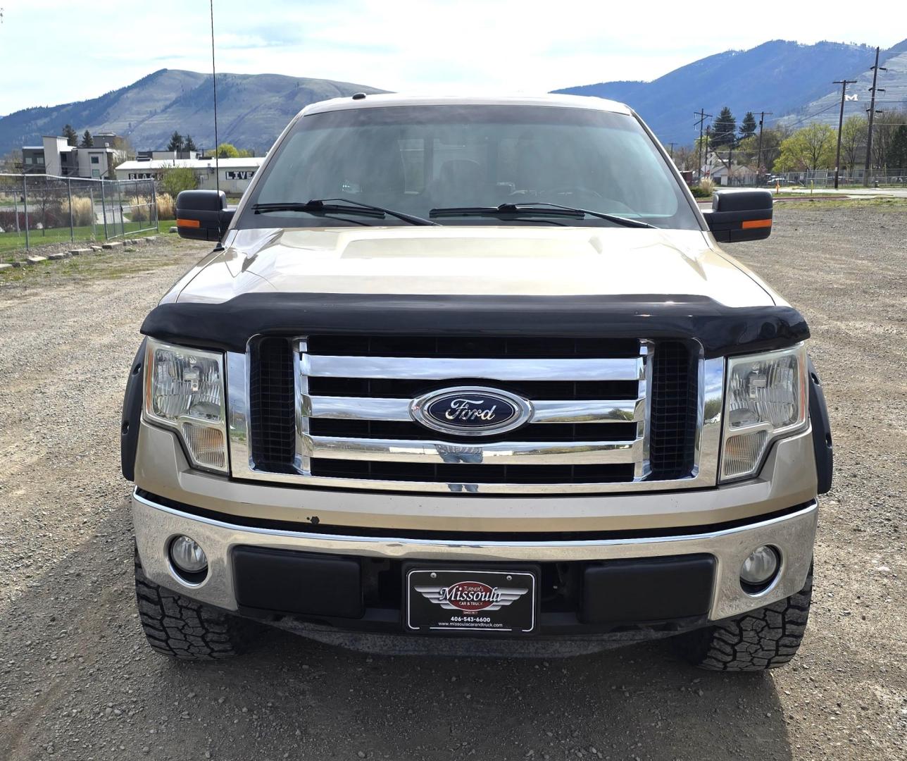 2011 Gold /Tan Ford F-150 FX4 SuperCrew 5.5-ft. Bed 4WD (1FTFW1EF6BK) with an 5.0L V8 engine, 4-Speed Automatic transmission, located at 450 N Russell, Missoula, MT, 59801, (406) 543-6600, 46.874496, -114.017433 - Mechanic's Special. Very Good physical condition. Runs pretty well but does have a miss. Mechanic says it has a bad valve which means pulling the head. I don't want to spend the money so you have a chance to own a really nice truck for less. 4WD works great. Air Blows Cold. Power Windows and locks. - Photo#7