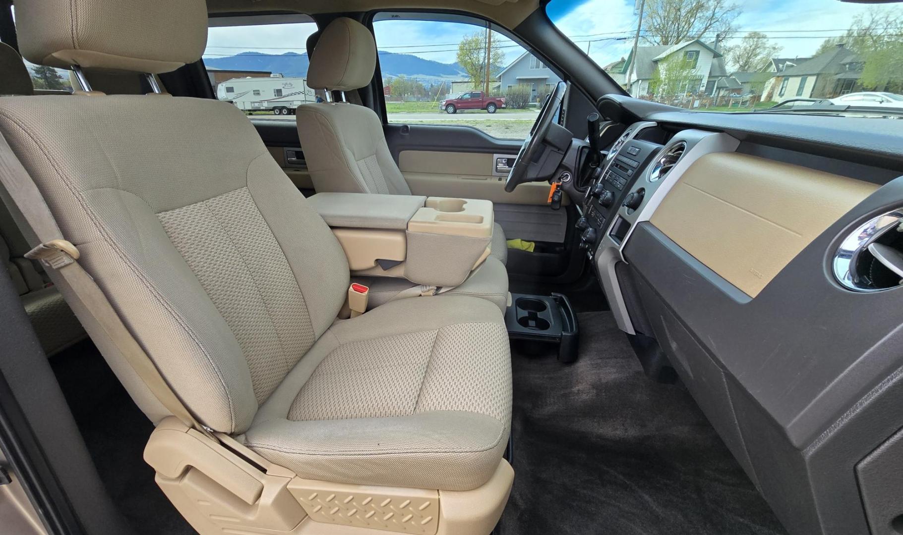 2011 Gold /Tan Ford F-150 FX4 SuperCrew 5.5-ft. Bed 4WD (1FTFW1EF6BK) with an 5.0L V8 engine, 4-Speed Automatic transmission, located at 450 N Russell, Missoula, MT, 59801, (406) 543-6600, 46.874496, -114.017433 - Mechanic's Special. Very Good physical condition. Runs pretty well but does have a miss. Mechanic says it has a bad valve which means pulling the head. I don't want to spend the money so you have a chance to own a really nice truck for less. 4WD works great. Air Blows Cold. Power Windows and locks. - Photo#11