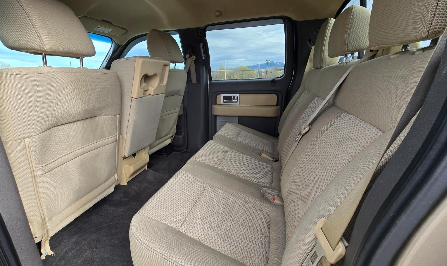 2011 Gold /Tan Ford F-150 FX4 SuperCrew 5.5-ft. Bed 4WD (1FTFW1EF6BK) with an 5.0L V8 engine, 4-Speed Automatic transmission, located at 450 N Russell, Missoula, MT, 59801, (406) 543-6600, 46.874496, -114.017433 - Mechanic's Special. Very Good physical condition. Runs pretty well but does have a miss. Mechanic says it has a bad valve which means pulling the head. I don't want to spend the money so you have a chance to own a really nice truck for less. 4WD works great. Air Blows Cold. Power Windows and locks. - Photo#10