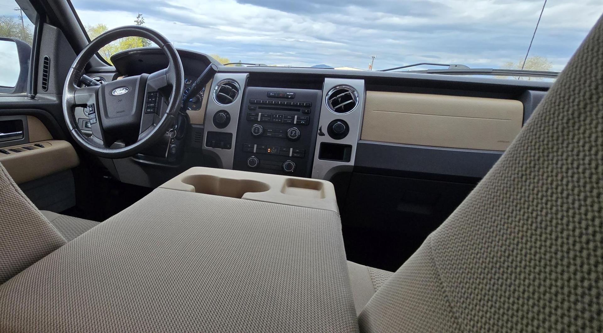 2011 Gold /Tan Ford F-150 FX4 SuperCrew 5.5-ft. Bed 4WD (1FTFW1EF6BK) with an 5.0L V8 engine, 4-Speed Automatic transmission, located at 450 N Russell, Missoula, MT, 59801, (406) 543-6600, 46.874496, -114.017433 - Mechanic's Special. Very Good physical condition. Runs pretty well but does have a miss. Mechanic says it has a bad valve which means pulling the head. I don't want to spend the money so you have a chance to own a really nice truck for less. 4WD works great. Air Blows Cold. Power Windows and locks. - Photo#13