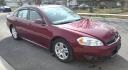2010 Red /Black Chevrolet Impala LT (2G1WB5EN4A1) with an 3.5L V6 OHV 12V engine, 4-Speed Automatic transmission, located at 450 N Russell, Missoula, MT, 59801, (406) 543-6600, 46.874496, -114.017433 - This Chevy Impala runs amazing and everything works. If it didn't have rust, we would price this much higher. 3.5L V6 Engine. Air. Cruise. Tilt. Power Sunroof. Heated Leather Seats. Remote Start. Power Windows and Locks. AM FM SAT CD Player. Clean Title and Carfax. - Photo#2