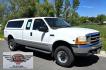 1999 White /Gray Ford F-250 SD Lariat SuperCab LWB 4WD (1FTNX21S9XE) with an 6.8L V10 SOHC 20V engine, Automatic transmission, located at 450 N Russell, Missoula, MT, 59801, (406) 543-6600, 46.874496, -114.017433 - Nice Owner Owner Truck with a Clean Carfax. Only 120,700 Miles. Powerful, Reliable V10 Engine. Automatic Transmission. 4WD with Locking Hubs. Long Box with Matching Topper. Power Drivers Seat. Air. Cruise. Tilt. Power Windows and Locks. AM FM Cassette CD Player. CB Radio. Because of the age, or L - Photo#1
