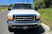 1999 White /Gray Ford F-250 SD Lariat SuperCab LWB 4WD (1FTNX21S9XE) with an 6.8L V10 SOHC 20V engine, Automatic transmission, located at 450 N Russell, Missoula, MT, 59801, (406) 543-6600, 46.874496, -114.017433 - Nice Owner Owner Truck with a Clean Carfax. Only 120,700 Miles. Powerful, Reliable V10 Engine. Automatic Transmission. 4WD with Locking Hubs. Long Box with Matching Topper. Power Drivers Seat. Air. Cruise. Tilt. Power Windows and Locks. AM FM Cassette CD Player. CB Radio. Because of the age, or L - Photo#3