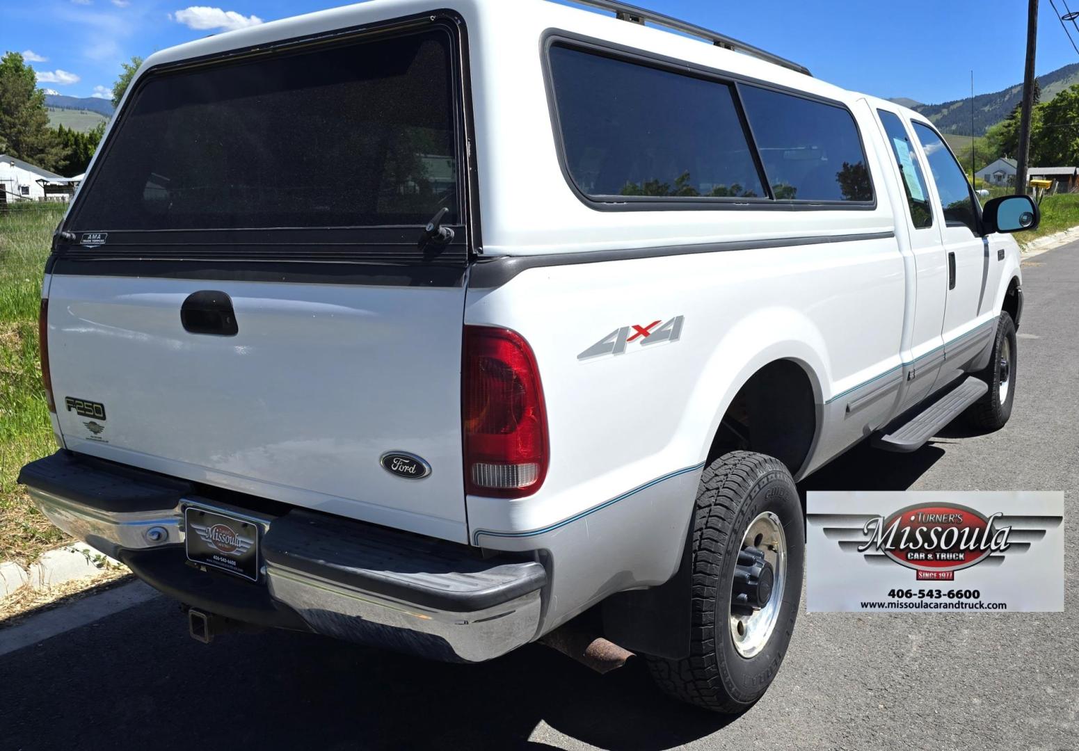 1999 White /Gray Ford F-250 SD Lariat SuperCab LWB 4WD (1FTNX21S9XE) with an 6.8L V10 SOHC 20V engine, Automatic transmission, located at 450 N Russell, Missoula, MT, 59801, (406) 543-6600, 46.874496, -114.017433 - Nice Owner Owner Truck with a Clean Carfax. Only 120,700 Miles. Powerful, Reliable V10 Engine. Automatic Transmission. 4WD with Locking Hubs. Long Box with Matching Topper. Power Drivers Seat. Air. Cruise. Tilt. Power Windows and Locks. AM FM Cassette CD Player. CB Radio. Because of the age, or L - Photo#4