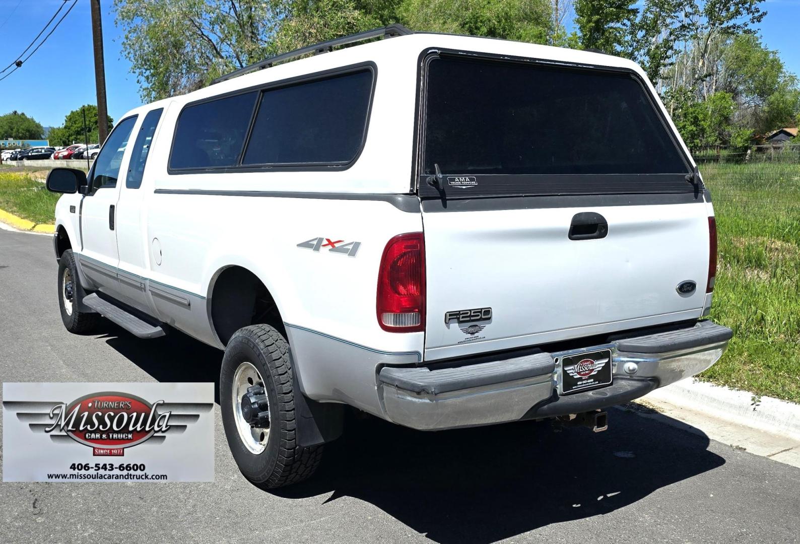 1999 White /Gray Ford F-250 SD Lariat SuperCab LWB 4WD (1FTNX21S9XE) with an 6.8L V10 SOHC 20V engine, Automatic transmission, located at 450 N Russell, Missoula, MT, 59801, (406) 543-6600, 46.874496, -114.017433 - Nice Owner Owner Truck with a Clean Carfax. Only 120,700 Miles. Powerful, Reliable V10 Engine. Automatic Transmission. 4WD with Locking Hubs. Long Box with Matching Topper. Power Drivers Seat. Air. Cruise. Tilt. Power Windows and Locks. AM FM Cassette CD Player. CB Radio. Because of the age, or L - Photo#8