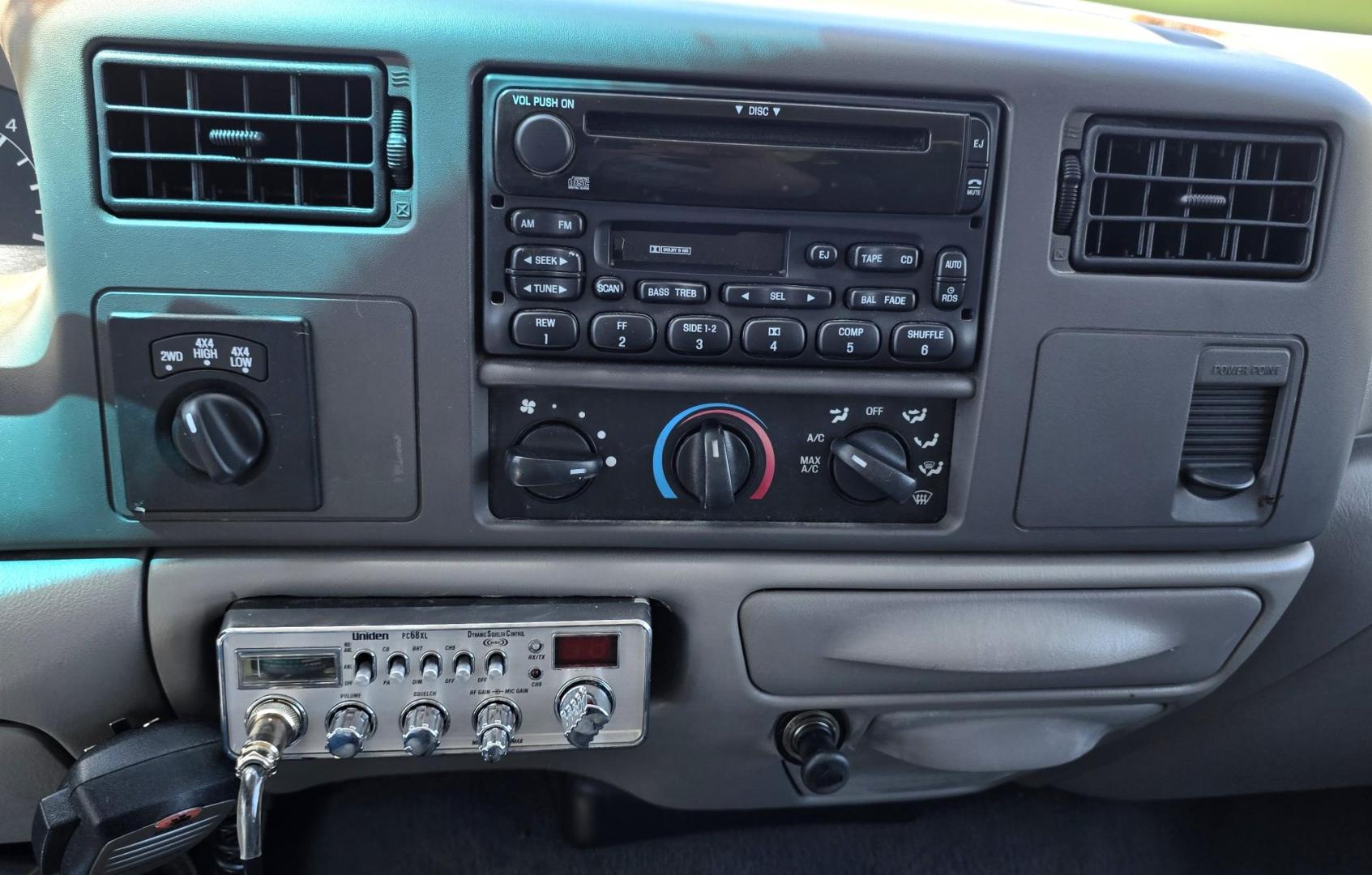 1999 White /Gray Ford F-250 SD Lariat SuperCab LWB 4WD (1FTNX21S9XE) with an 6.8L V10 SOHC 20V engine, Automatic transmission, located at 450 N Russell, Missoula, MT, 59801, (406) 543-6600, 46.874496, -114.017433 - Nice Owner Owner Truck with a Clean Carfax. Only 120,700 Miles. Powerful, Reliable V10 Engine. Automatic Transmission. 4WD with Locking Hubs. Long Box with Matching Topper. Power Drivers Seat. Air. Cruise. Tilt. Power Windows and Locks. AM FM Cassette CD Player. CB Radio. Because of the age, or L - Photo#13