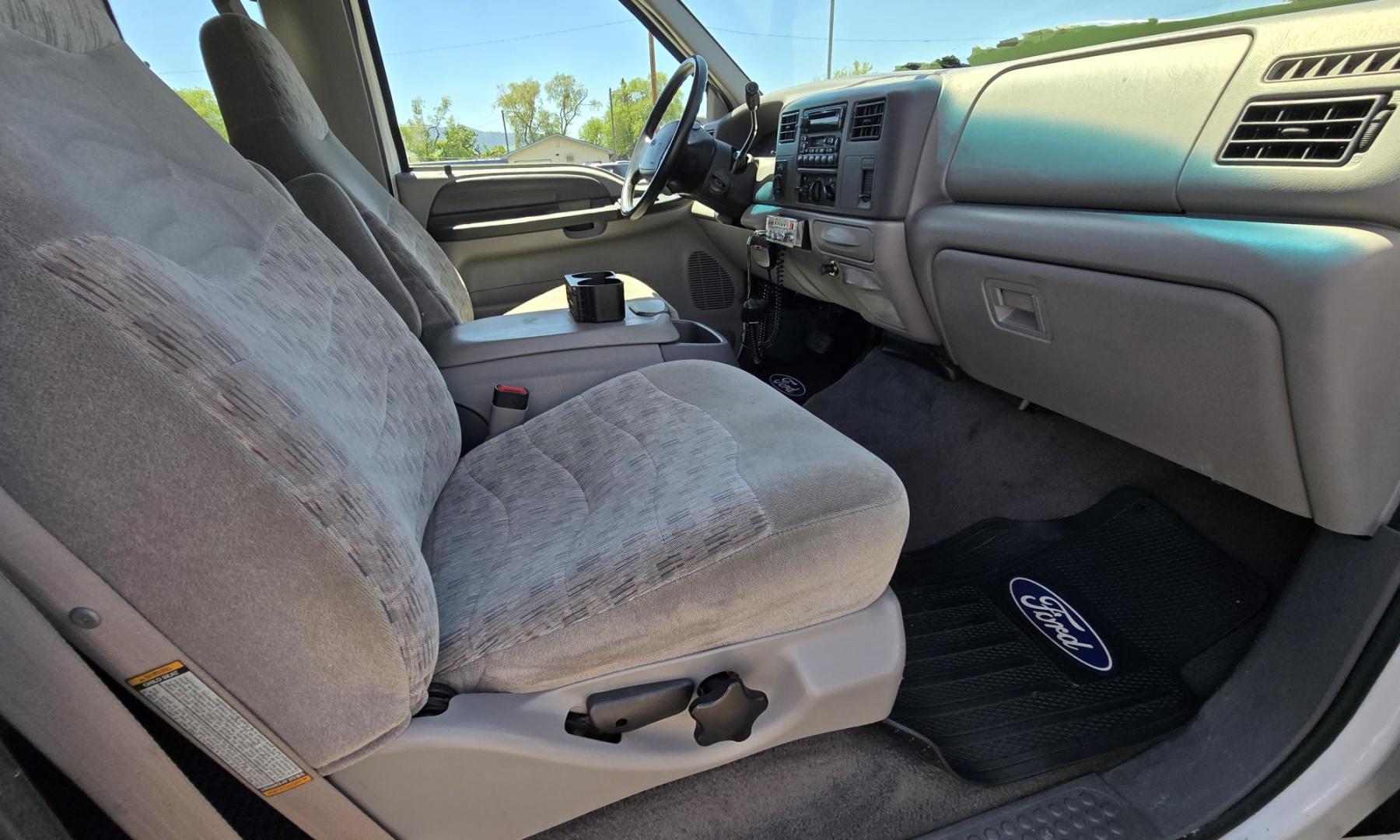 1999 White /Gray Ford F-250 SD Lariat SuperCab LWB 4WD (1FTNX21S9XE) with an 6.8L V10 SOHC 20V engine, Automatic transmission, located at 450 N Russell, Missoula, MT, 59801, (406) 543-6600, 46.874496, -114.017433 - Nice Owner Owner Truck with a Clean Carfax. Only 120,700 Miles. Powerful, Reliable V10 Engine. Automatic Transmission. 4WD with Locking Hubs. Long Box with Matching Topper. Power Drivers Seat. Air. Cruise. Tilt. Power Windows and Locks. AM FM Cassette CD Player. CB Radio. Because of the age, or L - Photo#19
