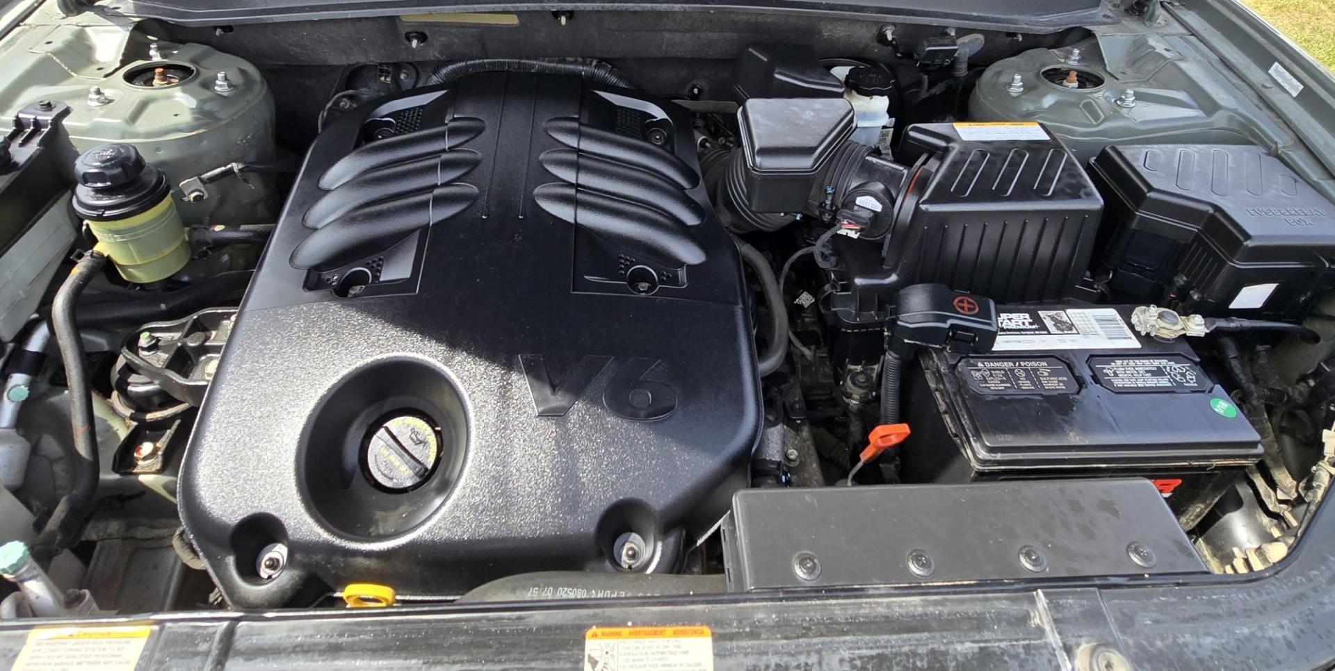 2009 Green /Tan Hyundai Santa Fe LE (5NMSH13E69H) with an 3.3L V6 DOHC 24V engine, 5-Speed Automatic transmission, located at 450 N Russell, Missoula, MT, 59801, (406) 543-6600, 46.874496, -114.017433 - Clean FWD SUV. 3.3L V6 Engine. Automatic Transmission. Air Cruise Tilt. Power Windows and Locks. 2 Owner with a Clean Title and Carfax. - Photo#18