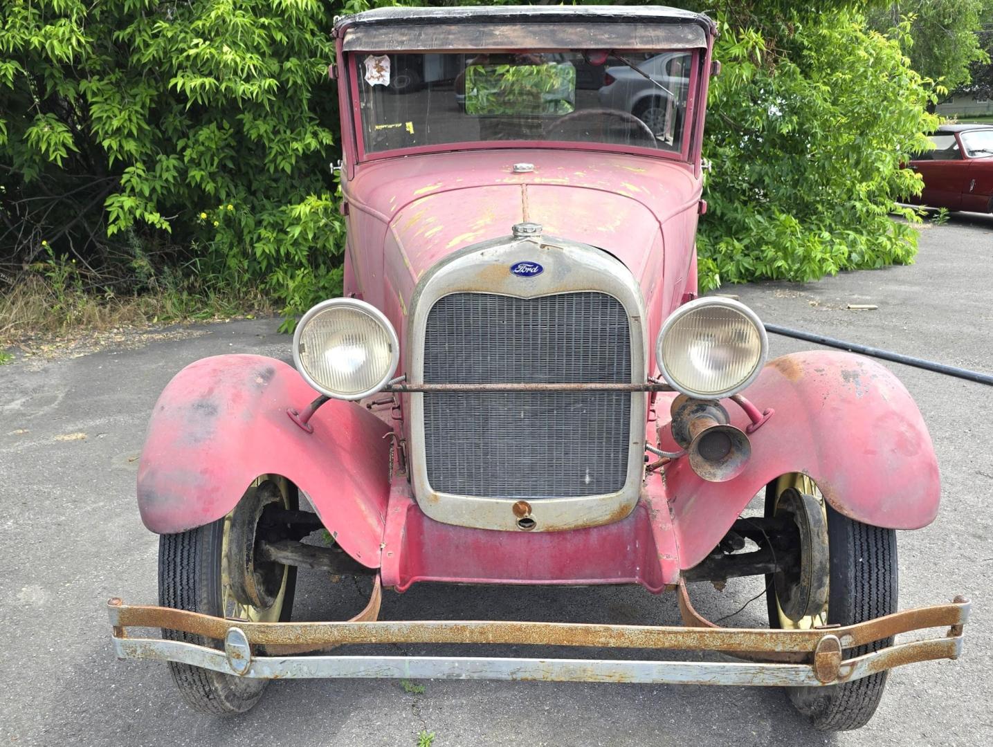 1928 Red /Tan Ford Model A with an Flathead 4 engine, manual transmission, located at 450 N Russell, Missoula, MT, 59801, (406) 543-6600, 46.874496, -114.017433 - Great Project to Restore or make a Cool Ratrod. Flathead Engine that was running as of 5 years ago. I'm sure the system will need to be cleaned out before running again. Selling AS IS for Parts or Restoration. Glass is Good. Body is overall good with a dent in the left rear fender. Interior is mostl - Photo#3