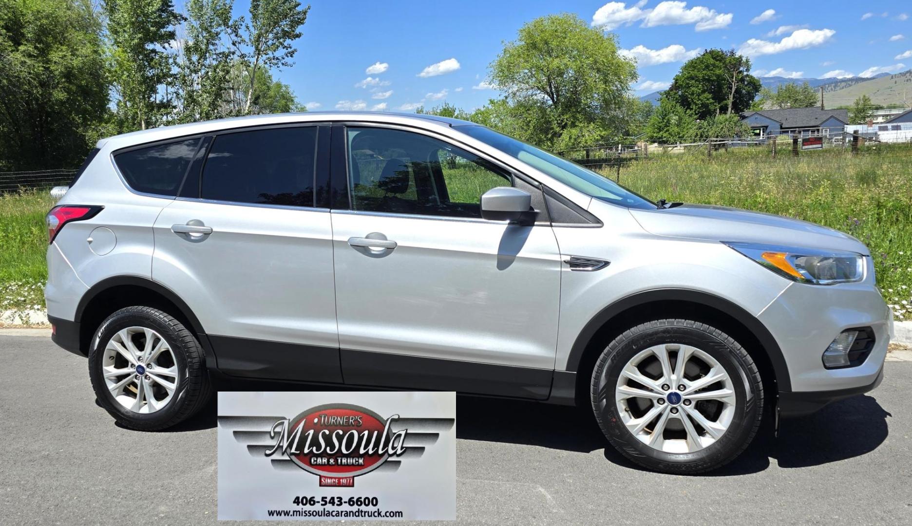2017 Silver /Black Ford Escape SE 4WD (1FMCU9G91HU) with an 2.0L L4 DOHC 16V engine, 6A transmission, located at 450 N Russell, Missoula, MT, 59801, (406) 543-6600, 46.874496, -114.017433 - Hard to Find Good Economy AWD with only 70k Miles. 2.0L I4 Engine. Automatic Transmission. Air. Cruise. Tilt. Backup Camera. Bluetooth Audio and Phone. Power Drivers Seat. Like New All-Season Radials. - Photo#1
