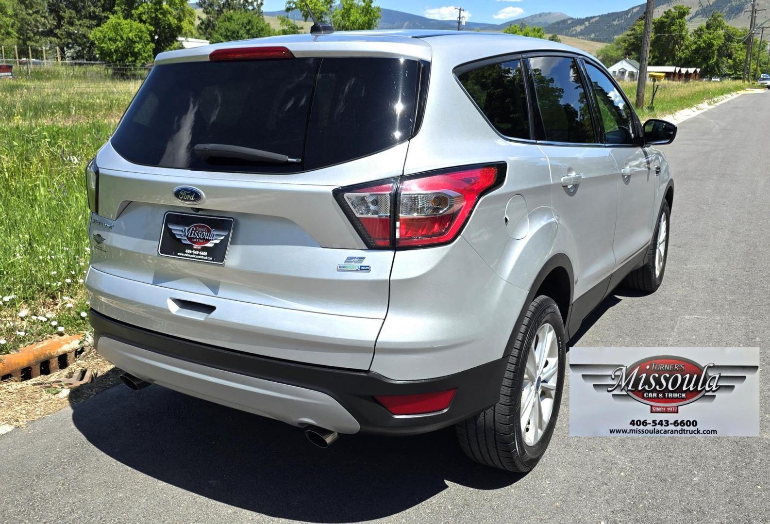 2017 Silver /Black Ford Escape SE 4WD (1FMCU9G91HU) with an 2.0L L4 DOHC 16V engine, 6A transmission, located at 450 N Russell, Missoula, MT, 59801, (406) 543-6600, 46.874496, -114.017433 - Hard to Find Good Economy AWD with only 70k Miles. 2.0L I4 Engine. Automatic Transmission. Air. Cruise. Tilt. Backup Camera. Bluetooth Audio and Phone. Power Drivers Seat. Like New All-Season Radials. - Photo#4