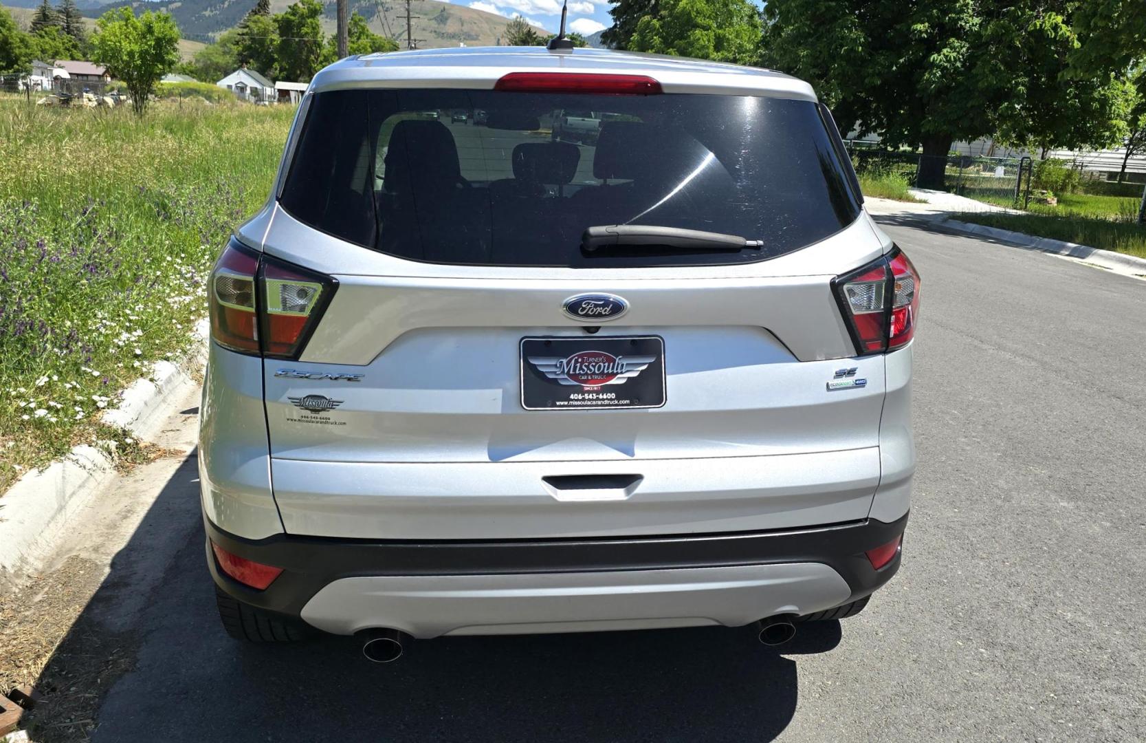 2017 Silver /Black Ford Escape SE 4WD (1FMCU9G91HU) with an 2.0L L4 DOHC 16V engine, 6A transmission, located at 450 N Russell, Missoula, MT, 59801, (406) 543-6600, 46.874496, -114.017433 - Hard to Find Good Economy AWD with only 70k Miles. 2.0L I4 Engine. Automatic Transmission. Air. Cruise. Tilt. Backup Camera. Bluetooth Audio and Phone. Power Drivers Seat. Like New All-Season Radials. - Photo#5