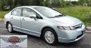 2006 Blue /Gray Honda Civic Hybrid CVT (JHMFA36256S) with an 1.3L L4 SOHC 8V HYBRID engine, Automatic CVT Overdrive transmission, located at 450 N Russell, Missoula, MT, 59801, (406) 543-6600, 46.874496, -114.017433 - Great Fuel Economy for a low price. 1.3L I4 Hybrid. Automatic Transmission. Air. Cruise. Tilt. Power Windows and Locks. It has a maintenance light on, but that's only because the reset button isn't working for days since last oil change. Has a couple dings and a crack in the rear bumper. Well below - Photo#1