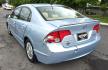 2006 Blue /Gray Honda Civic Hybrid CVT (JHMFA36256S) with an 1.3L L4 SOHC 8V HYBRID engine, Automatic CVT Overdrive transmission, located at 450 N Russell, Missoula, MT, 59801, (406) 543-6600, 46.874496, -114.017433 - Great Fuel Economy for a low price. 1.3L I4 Hybrid. Automatic Transmission. Air. Cruise. Tilt. Power Windows and Locks. It has a maintenance light on, but that's only because the reset button isn't working for days since last oil change. Has a couple dings and a crack in the rear bumper. Well below - Photo#5