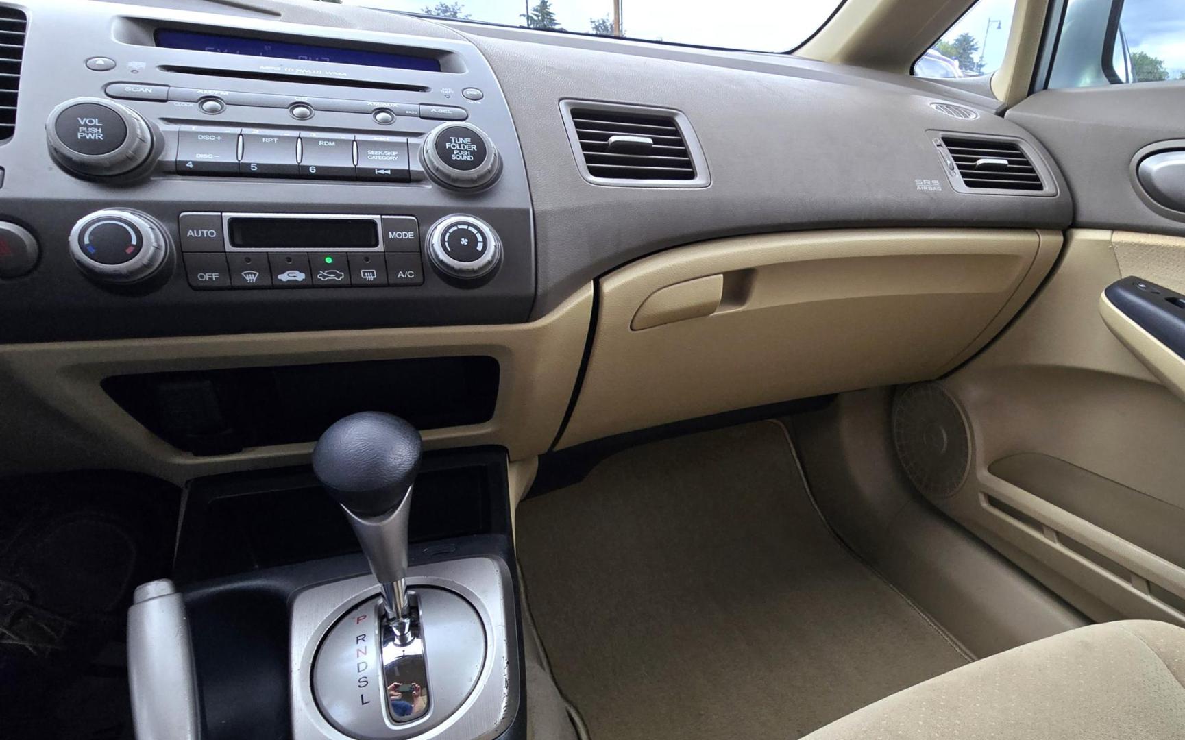 2006 Blue /Gray Honda Civic Hybrid CVT (JHMFA36256S) with an 1.3L L4 SOHC 8V HYBRID engine, Automatic CVT Overdrive transmission, located at 450 N Russell, Missoula, MT, 59801, (406) 543-6600, 46.874496, -114.017433 - Great Fuel Economy for a low price. 1.3L I4 Hybrid. Automatic Transmission. Air. Cruise. Tilt. Power Windows and Locks. It has a maintenance light on, but that's only because the reset button isn't working for days since last oil change. Has a couple dings and a crack in the rear bumper. Well below - Photo#10