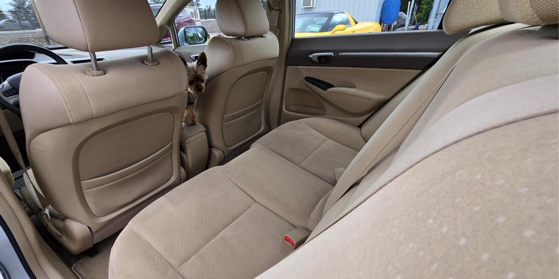 2006 Blue /Gray Honda Civic Hybrid CVT (JHMFA36256S) with an 1.3L L4 SOHC 8V HYBRID engine, Automatic CVT Overdrive transmission, located at 450 N Russell, Missoula, MT, 59801, (406) 543-6600, 46.874496, -114.017433 - Great Fuel Economy for a low price. 1.3L I4 Hybrid. Automatic Transmission. Air. Cruise. Tilt. Power Windows and Locks. It has a maintenance light on, but that's only because the reset button isn't working for days since last oil change. Has a couple dings and a crack in the rear bumper. Well below - Photo#13
