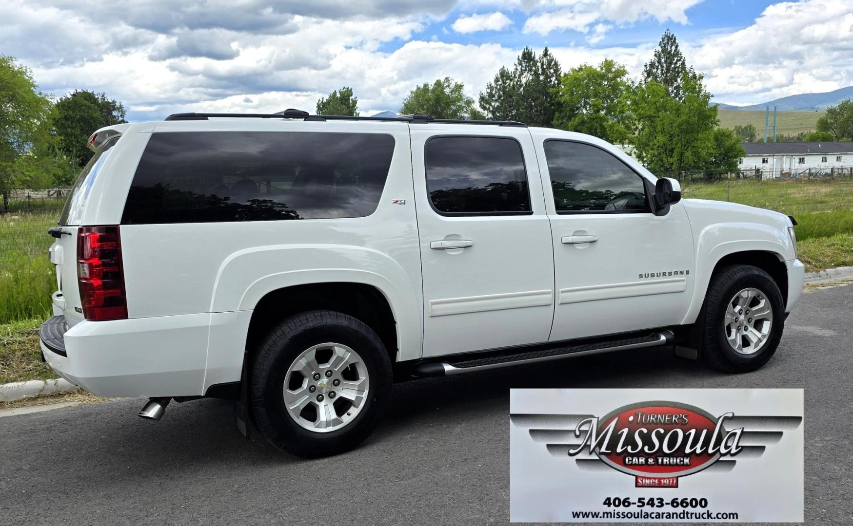 2009 White /Black Chevrolet Suburban LT1 1500 4WD (1GNFK26319R) with an 5.3L V8 OHV 16V FFV engine, 4-Speed Automatic transmission, located at 450 N Russell, Missoula, MT, 59801, (406) 543-6600, 46.874496, -114.017433 - Big Sexy 4WD SUV in Excellent Condition. 5.3L V8 Engine. 3rd Row Seating. Leather Seats. Heated Front and Middle Seats. Rear Entertainment. Power Sunroof. Power Liftgate. Front and Rear Climate Control. Towing. Running Boards. AM FM XM CD DVD and Navigation. Excellent Michelin Tires. We Finance - Photo#4