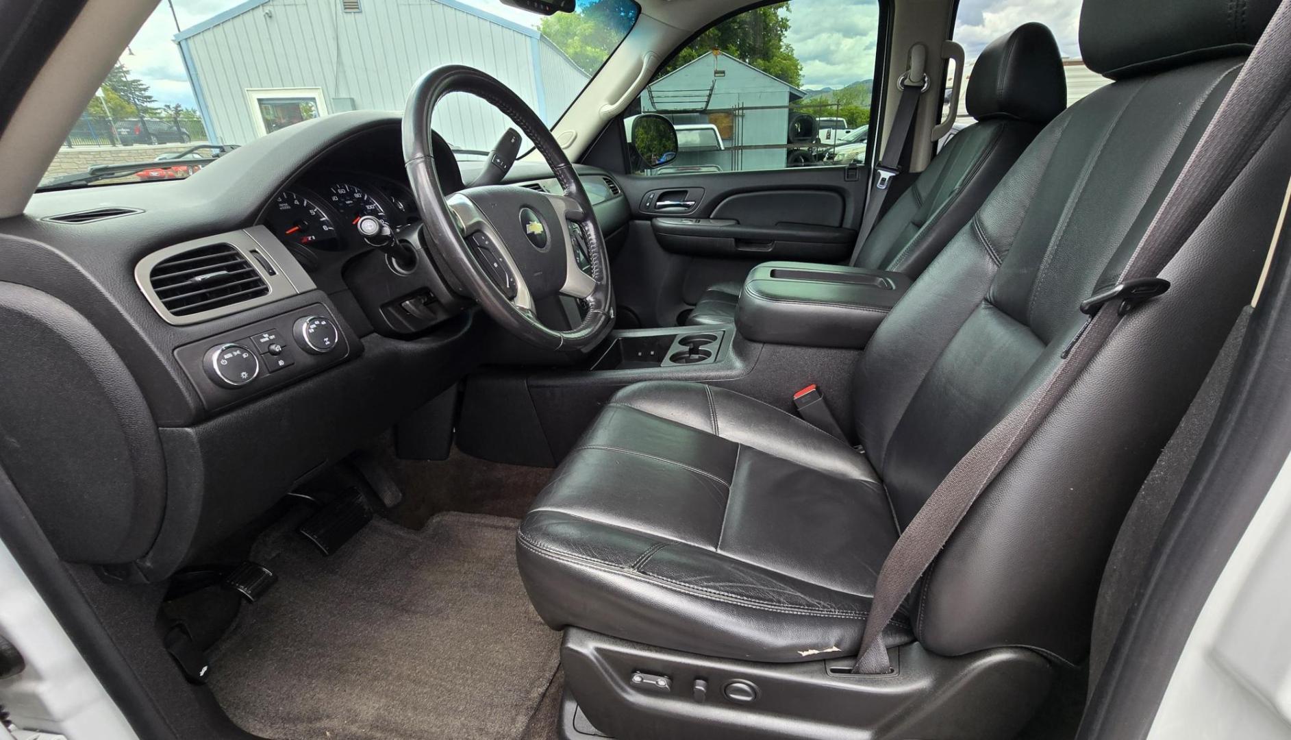 2009 White /Black Chevrolet Suburban LT1 1500 4WD (1GNFK26319R) with an 5.3L V8 OHV 16V FFV engine, 4-Speed Automatic transmission, located at 450 N Russell, Missoula, MT, 59801, (406) 543-6600, 46.874496, -114.017433 - Big Sexy 4WD SUV in Excellent Condition. 5.3L V8 Engine. 3rd Row Seating. Leather Seats. Heated Front and Middle Seats. Rear Entertainment. Power Sunroof. Power Liftgate. Front and Rear Climate Control. Towing. Running Boards. AM FM XM CD DVD and Navigation. Excellent Michelin Tires. We Finance - Photo#17