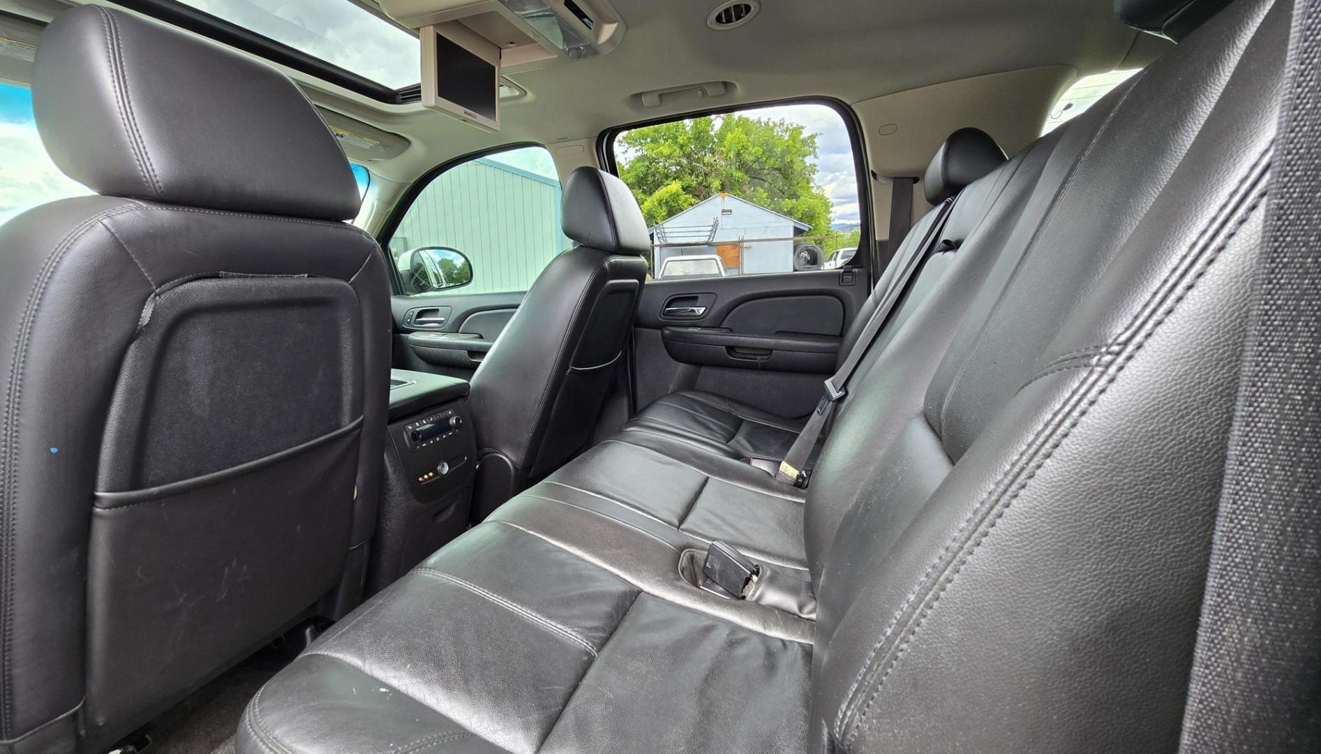 2009 White /Black Chevrolet Suburban LT1 1500 4WD (1GNFK26319R) with an 5.3L V8 OHV 16V FFV engine, 4-Speed Automatic transmission, located at 450 N Russell, Missoula, MT, 59801, (406) 543-6600, 46.874496, -114.017433 - Big Sexy 4WD SUV in Excellent Condition. 5.3L V8 Engine. 3rd Row Seating. Leather Seats. Heated Front and Middle Seats. Rear Entertainment. Power Sunroof. Power Liftgate. Front and Rear Climate Control. Towing. Running Boards. AM FM XM CD DVD and Navigation. Excellent Michelin Tires. We Finance - Photo#18