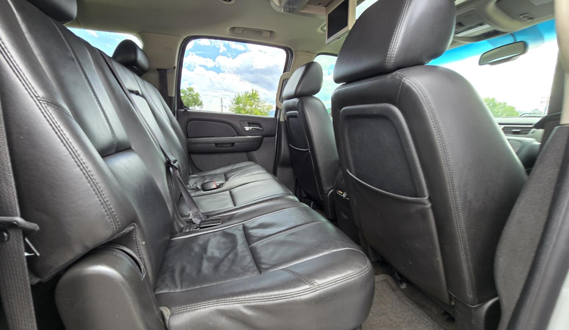 2009 White /Black Chevrolet Suburban LT1 1500 4WD (1GNFK26319R) with an 5.3L V8 OHV 16V FFV engine, 4-Speed Automatic transmission, located at 450 N Russell, Missoula, MT, 59801, (406) 543-6600, 46.874496, -114.017433 - Big Sexy 4WD SUV in Excellent Condition. 5.3L V8 Engine. 3rd Row Seating. Leather Seats. Heated Front and Middle Seats. Rear Entertainment. Power Sunroof. Power Liftgate. Front and Rear Climate Control. Towing. Running Boards. AM FM XM CD DVD and Navigation. Excellent Michelin Tires. We Finance - Photo#22
