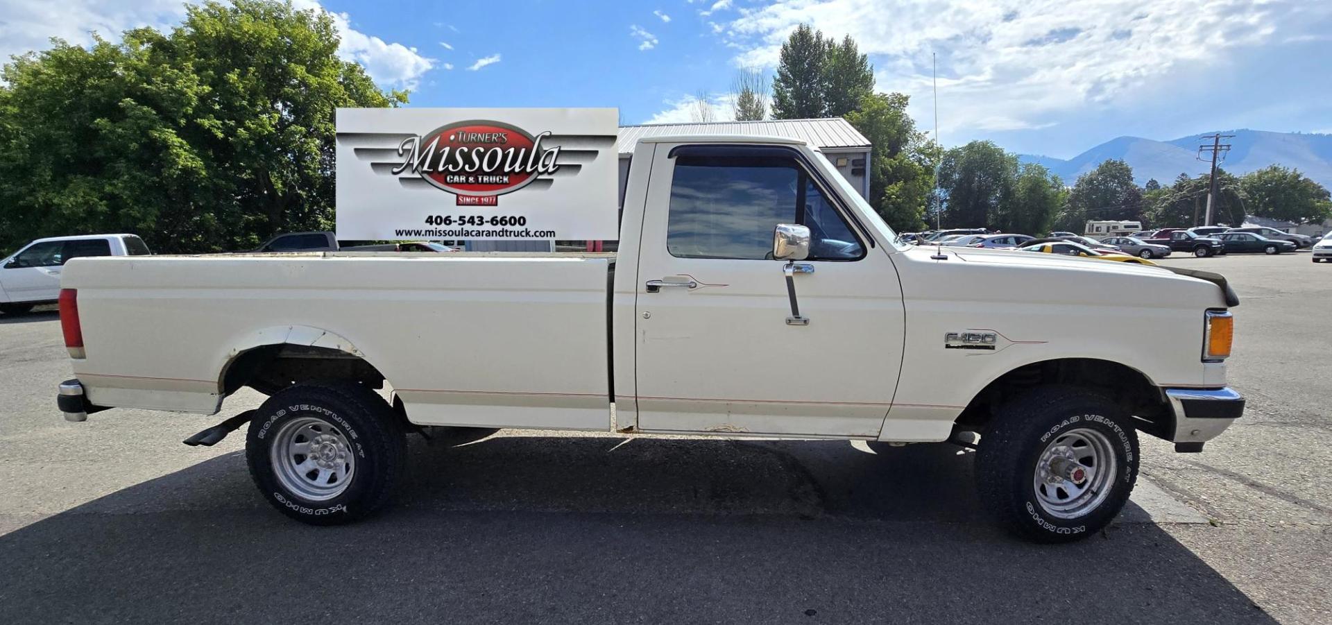 1989 White /Black Ford F-150 Reg. Cab Long Bed 4WD (1FTEF14Y0KP) with an 4.9L L6 OHV 12V engine, 4-Speed Automatic Overdrive transmission, located at 450 N Russell, Missoula, MT, 59801, (406) 543-6600, 46.874496, -114.017433 - Photo#5