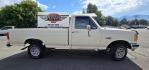 1989 White /Black Ford F-150 Reg. Cab Long Bed 4WD (1FTEF14Y0KP) with an 4.9L L6 OHV 12V engine, 4-Speed Automatic Overdrive transmission, located at 450 N Russell, Missoula, MT, 59801, (406) 543-6600, 46.874496, -114.017433 - Photo#5