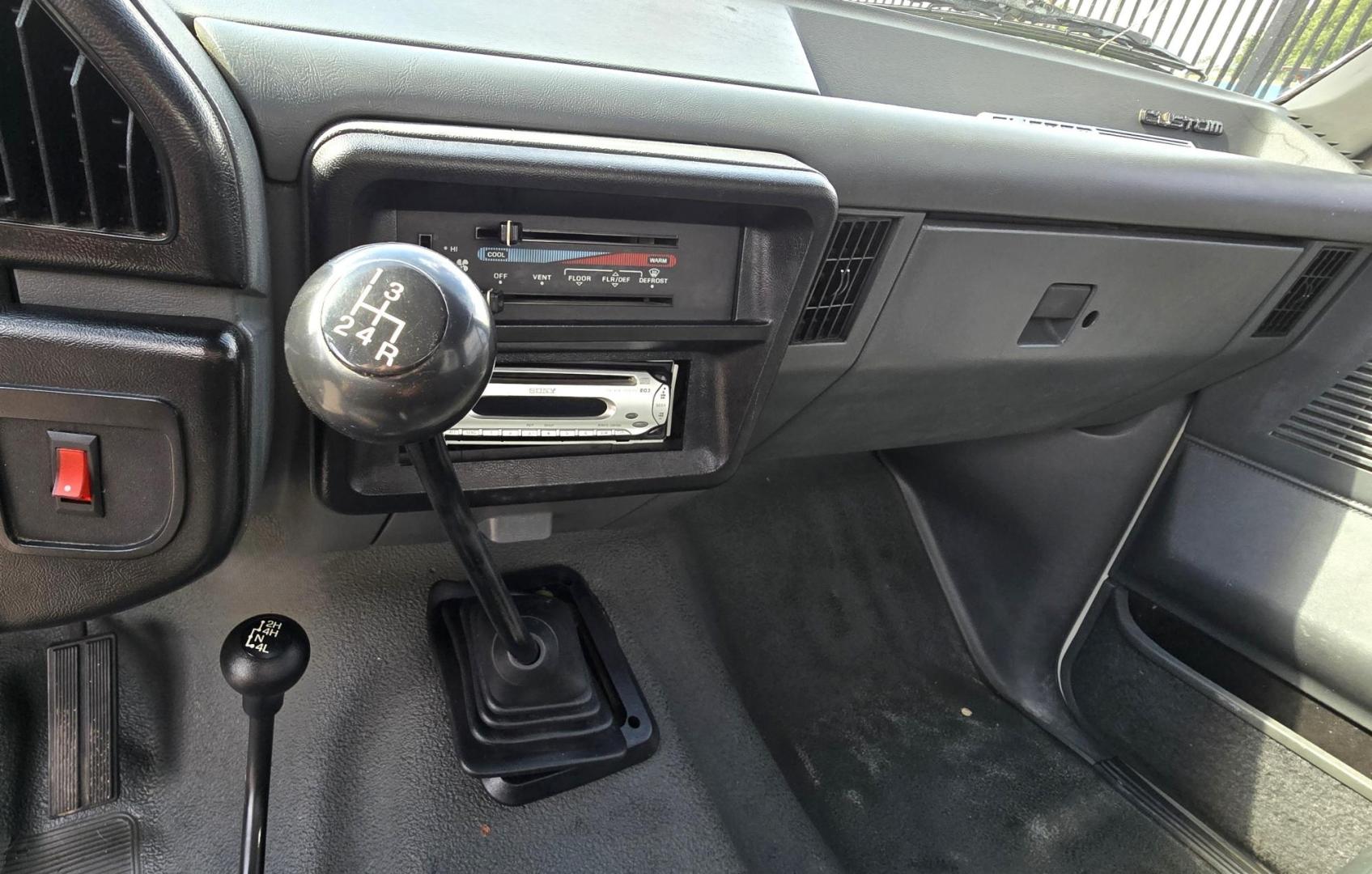 1989 White /Black Ford F-150 Reg. Cab Long Bed 4WD (1FTEF14Y0KP) with an 4.9L L6 OHV 12V engine, 4-Speed Automatic Overdrive transmission, located at 450 N Russell, Missoula, MT, 59801, (406) 543-6600, 46.874496, -114.017433 - Photo#11