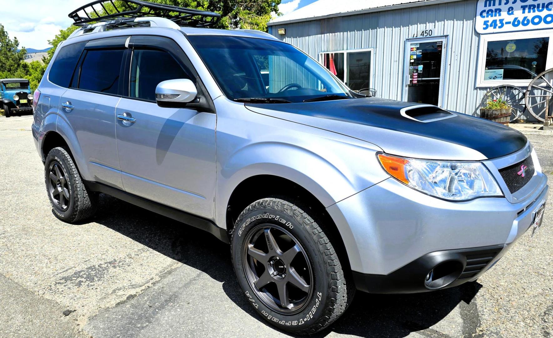 2012 Silver /Black Subaru Forester 2.5XT Touring (JF2SHGGC1CH) with an 2.5L H4 SOHC 16V engine, 4-Speed Automatic transmission, located at 450 N Russell, Missoula, MT, 59801, (406) 543-6600, 46.874496, -114.017433 - Beefy Subaru Forester with 2.5XT Turbo Engine that was installed only 3,000 miles ago. Comes with Cobb Tuner. Has New Axles and Suspension. Automatic Transmission. Power Sunroof. AM FM SAT CD Bluetooth. Backup Camera. Air. Cruise. Tilt. Power Windows and Locks. Remote Start. Heated Leather Seats. Th - Photo#8