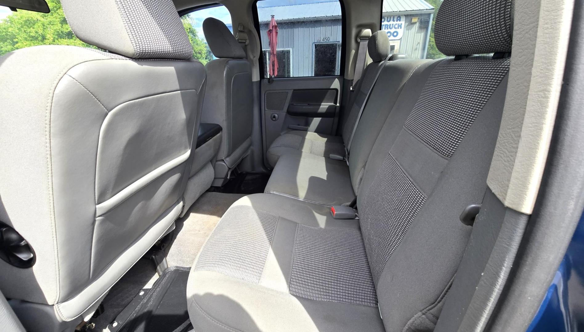 2006 Blue /Gray Dodge Ram 1500 SLT Quad Cab 4WD (1D7HU18246S) with an 5.7L V8 OHV 16V engine, 5-Speed Automatic Overdrive transmission, located at 450 N Russell, Missoula, MT, 59801, (406) 543-6600, 46.874496, -114.017433 - Beautiful 4WD Dodge with 5.7L Hemi. Automatic Transmission. Air. Cruise. Tilt. Hefty Grill Guard. AM FM CD Player. Power Drivers Seat. Power Windows and Locks. Towing. Nice Wheels and Tires. We Finance through local Credit Unions. We do NOT offer In House (Buy Here Pay Here) Financing. - Photo#10