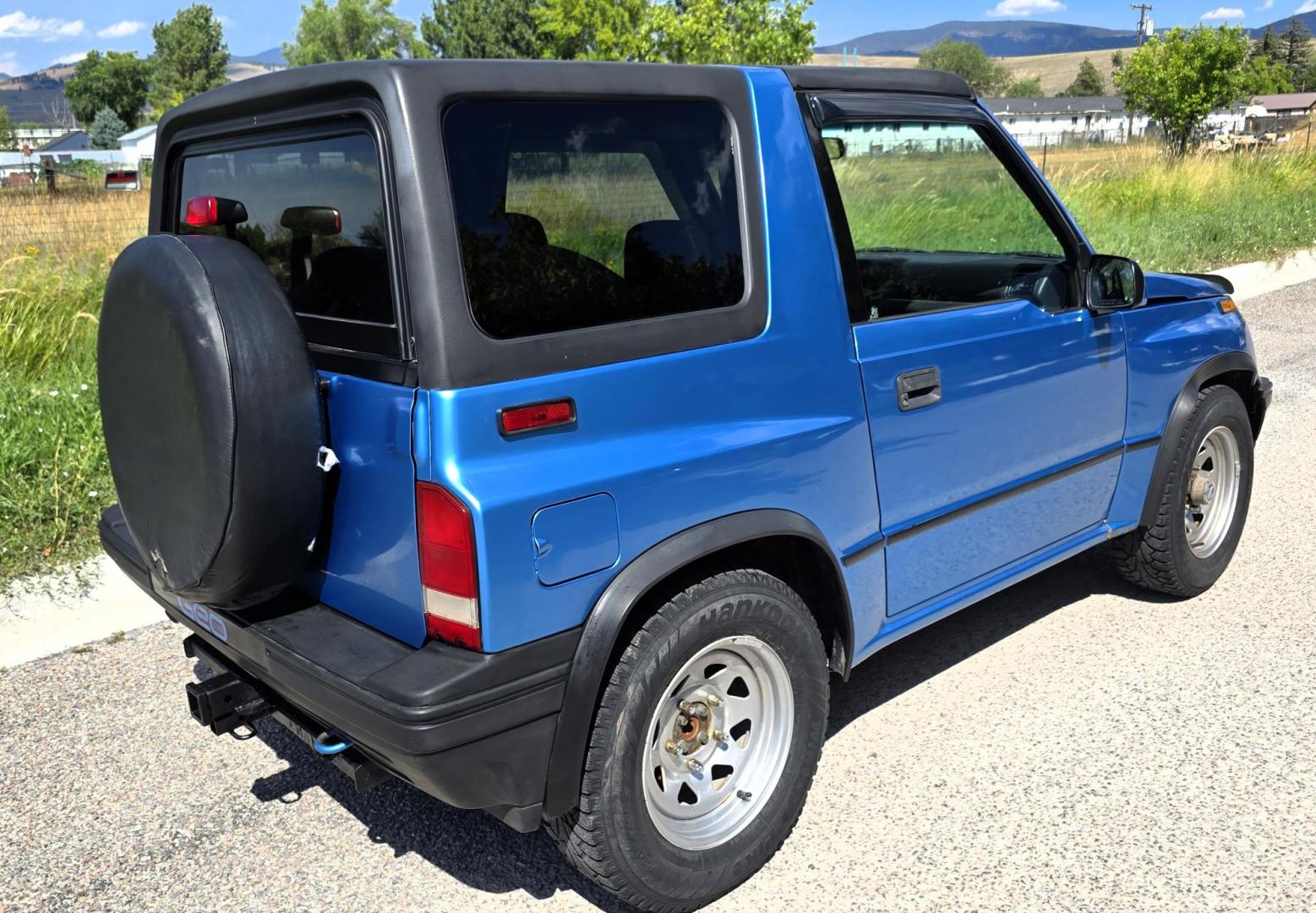 1995 Blue /Blue Geo Tracker 2-Door 4WD (2CNBJ186XS6) with an 1.6L L4 SOHC 16V engine, located at 450 N Russell, Missoula, MT, 59801, (406) 543-6600, 46.874496, -114.017433 - Cute as a Bug. 4WD GEO Tracker. Impossible to find in this condition. 1.6L I4 Engine. 5 Speed Manual Transmission. Locking Hubs. Tops come off for those hot days in the Mountains. Comes with an extra set of tires and wheels. Try to find another Tracker as nice as this for this price. Because of - Photo#2
