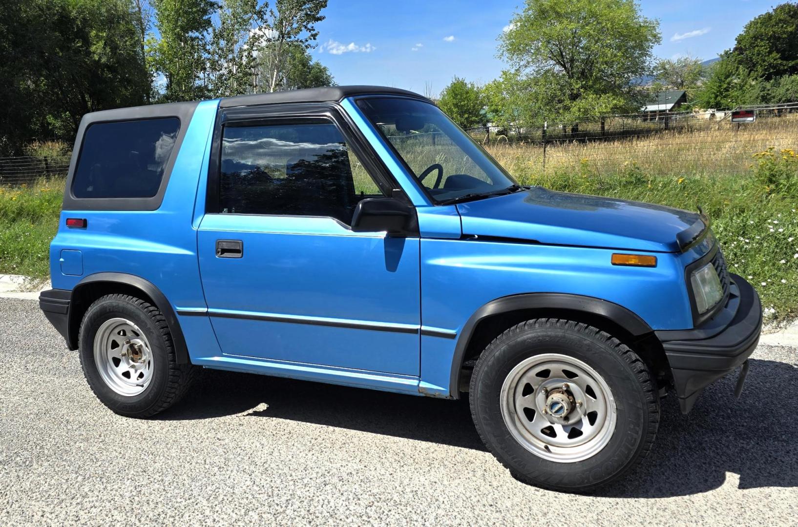 1995 Blue /Blue Geo Tracker 2-Door 4WD (2CNBJ186XS6) with an 1.6L L4 SOHC 16V engine, located at 450 N Russell, Missoula, MT, 59801, (406) 543-6600, 46.874496, -114.017433 - Cute as a Bug. 4WD GEO Tracker. Impossible to find in this condition. 1.6L I4 Engine. 5 Speed Manual Transmission. Locking Hubs. Tops come off for those hot days in the Mountains. Comes with an extra set of tires and wheels. Try to find another Tracker as nice as this for this price. Because of - Photo#0