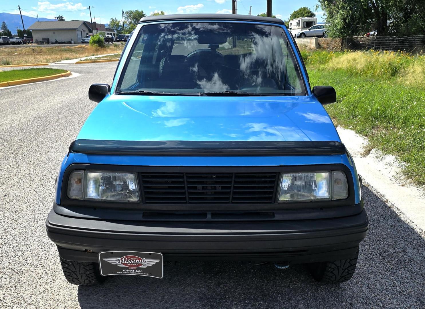 1995 Blue /Blue Geo Tracker 2-Door 4WD (2CNBJ186XS6) with an 1.6L L4 SOHC 16V engine, located at 450 N Russell, Missoula, MT, 59801, (406) 543-6600, 46.874496, -114.017433 - Cute as a Bug. 4WD GEO Tracker. Impossible to find in this condition. 1.6L I4 Engine. 5 Speed Manual Transmission. Locking Hubs. Tops come off for those hot days in the Mountains. Comes with an extra set of tires and wheels. Try to find another Tracker as nice as this for this price. Because of - Photo#4