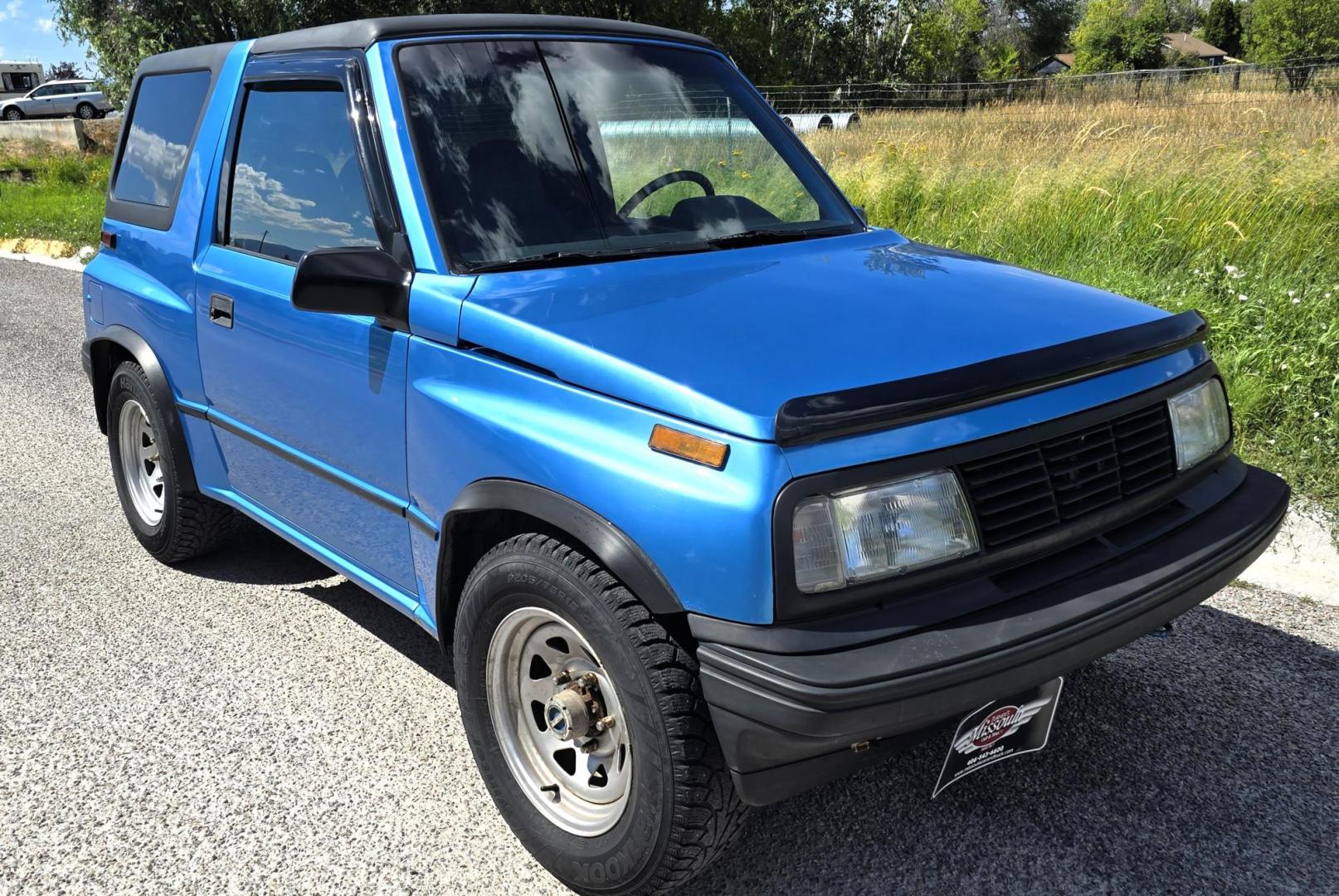 1995 Blue /Blue Geo Tracker 2-Door 4WD (2CNBJ186XS6) with an 1.6L L4 SOHC 16V engine, located at 450 N Russell, Missoula, MT, 59801, (406) 543-6600, 46.874496, -114.017433 - Cute as a Bug. 4WD GEO Tracker. Impossible to find in this condition. 1.6L I4 Engine. 5 Speed Manual Transmission. Locking Hubs. Tops come off for those hot days in the Mountains. Comes with an extra set of tires and wheels. Try to find another Tracker as nice as this for this price. Because of - Photo#3