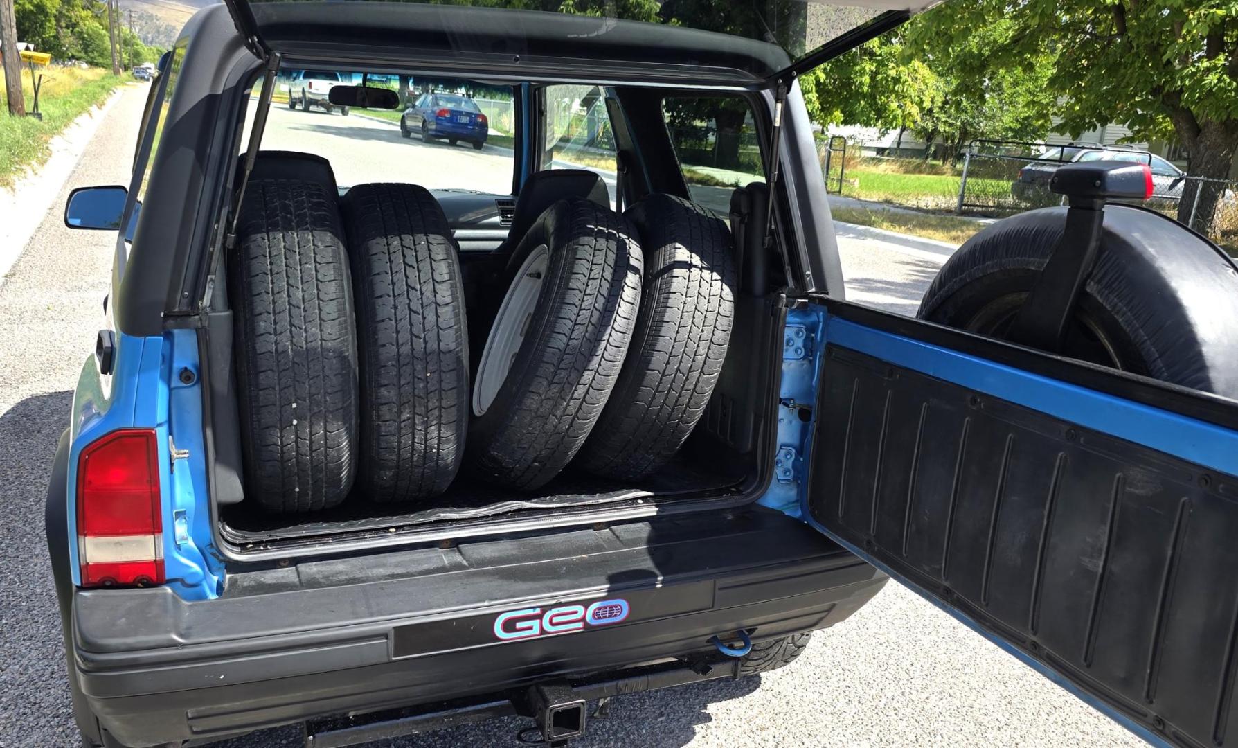 1995 Blue /Blue Geo Tracker 2-Door 4WD (2CNBJ186XS6) with an 1.6L L4 SOHC 16V engine, located at 450 N Russell, Missoula, MT, 59801, (406) 543-6600, 46.874496, -114.017433 - Cute as a Bug. 4WD GEO Tracker. Impossible to find in this condition. 1.6L I4 Engine. 5 Speed Manual Transmission. Locking Hubs. Tops come off for those hot days in the Mountains. Comes with an extra set of tires and wheels. Try to find another Tracker as nice as this for this price. Because of - Photo#10