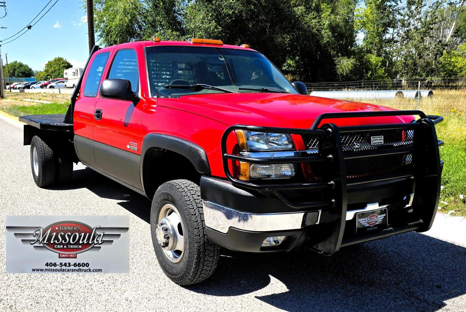 2004 Red /Gray Chevrolet Silverado 3500 Ext. Cab 4WD (1GCJK392X4E) with an 6.6L V8 OHV 32V TURBO DIESEL engine, 6 Speed Manual transmission, located at 450 N Russell, Missoula, MT, 59801, (406) 543-6600, 46.874496, -114.017433 - The Ultimate Unicorn of Chevy Trucks. One Ton Dually, Flatbed, 6.6L Duramax Diesel with a 6 Speed Manual Transmission. And Only 129K Miles! Tires are like New. Air. Cruise. Tilt. Power Windows and Locks. AM FM CD Player, Brush Guard. Headache Rack. Because of the age of this Vehicle, our lenders - Photo#4