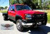 2004 Red /Gray Chevrolet Silverado 3500 Ext. Cab 4WD (1GCJK392X4E) with an 6.6L V8 OHV 32V TURBO DIESEL engine, 6 Speed Manual transmission, located at 450 N Russell, Missoula, MT, 59801, (406) 543-6600, 46.874496, -114.017433 - The Ultimate Unicorn of Chevy Trucks. One Ton Dually, Flatbed, 6.6L Duramax Diesel with a 6 Speed Manual Transmission. And Only 129K Miles! Tires are like New. Air. Cruise. Tilt. Power Windows and Locks. AM FM CD Player, Brush Guard. Headache Rack. Because of the age of this Vehicle, our lenders - Photo#4