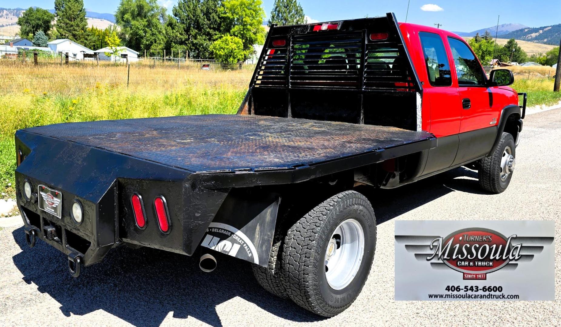 2004 Red /Gray Chevrolet Silverado 3500 Ext. Cab 4WD (1GCJK392X4E) with an 6.6L V8 OHV 32V TURBO DIESEL engine, 6 Speed Manual transmission, located at 450 N Russell, Missoula, MT, 59801, (406) 543-6600, 46.874496, -114.017433 - The Ultimate Unicorn of Chevy Trucks. One Ton Dually, Flatbed, 6.6L Duramax Diesel with a 6 Speed Manual Transmission. And Only 129K Miles! Tires are like New. Air. Cruise. Tilt. Power Windows and Locks. AM FM CD Player, Brush Guard. Headache Rack. Because of the age of this Vehicle, our lenders - Photo#7