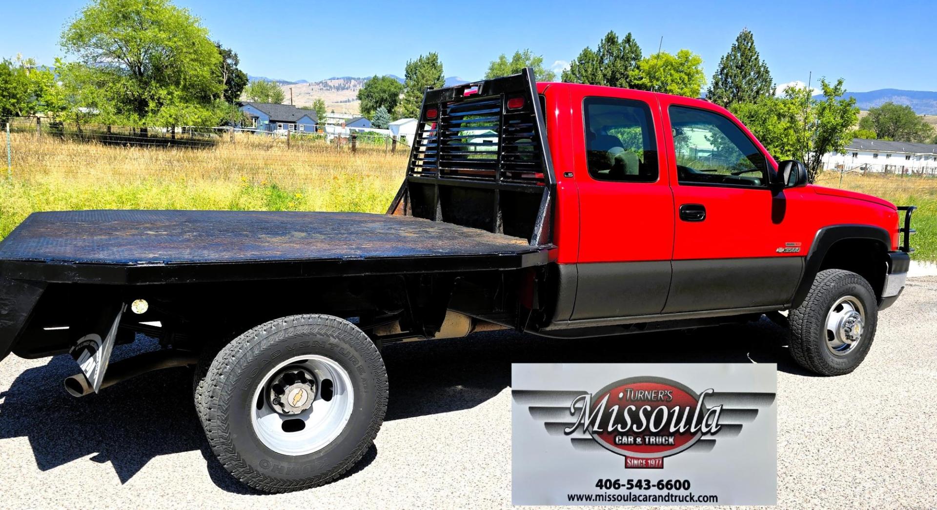 2004 Red /Gray Chevrolet Silverado 3500 Ext. Cab 4WD (1GCJK392X4E) with an 6.6L V8 OHV 32V TURBO DIESEL engine, 6 Speed Manual transmission, located at 450 N Russell, Missoula, MT, 59801, (406) 543-6600, 46.874496, -114.017433 - The Ultimate Unicorn of Chevy Trucks. One Ton Dually, Flatbed, 6.6L Duramax Diesel with a 6 Speed Manual Transmission. And Only 129K Miles! Tires are like New. Air. Cruise. Tilt. Power Windows and Locks. AM FM CD Player, Brush Guard. Headache Rack. Because of the age of this Vehicle, our lenders - Photo#5