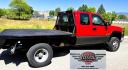 2004 Red /Gray Chevrolet Silverado 3500 Ext. Cab 4WD (1GCJK392X4E) with an 6.6L V8 OHV 32V TURBO DIESEL engine, 6 Speed Manual transmission, located at 450 N Russell, Missoula, MT, 59801, (406) 543-6600, 46.874496, -114.017433 - The Ultimate Unicorn of Chevy Trucks. One Ton Dually, Flatbed, 6.6L Duramax Diesel with a 6 Speed Manual Transmission. And Only 129K Miles! Tires are like New. Air. Cruise. Tilt. Power Windows and Locks. AM FM CD Player, Brush Guard. Headache Rack. Because of the age of this Vehicle, our lenders - Photo#5