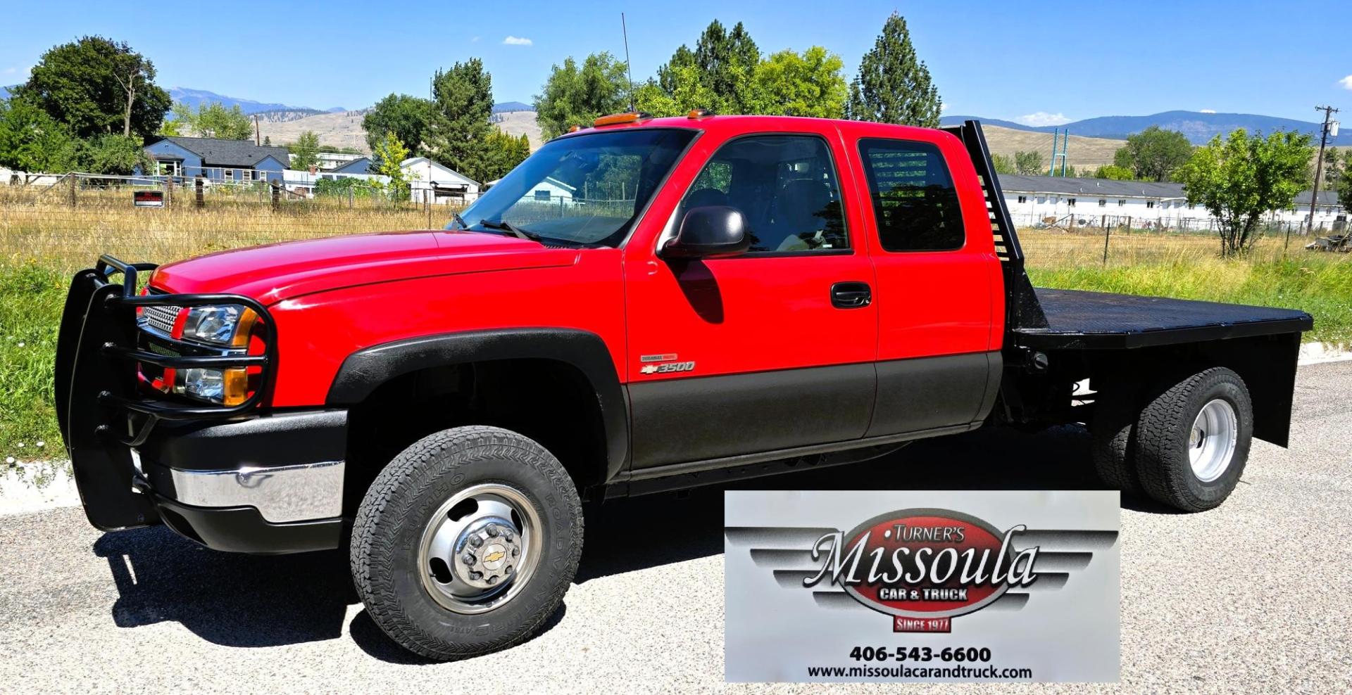 2004 Red /Gray Chevrolet Silverado 3500 Ext. Cab 4WD (1GCJK392X4E) with an 6.6L V8 OHV 32V TURBO DIESEL engine, 6 Speed Manual transmission, located at 450 N Russell, Missoula, MT, 59801, (406) 543-6600, 46.874496, -114.017433 - The Ultimate Unicorn of Chevy Trucks. One Ton Dually, Flatbed, 6.6L Duramax Diesel with a 6 Speed Manual Transmission. And Only 129K Miles! Tires are like New. Air. Cruise. Tilt. Power Windows and Locks. AM FM CD Player, Brush Guard. Headache Rack. Because of the age of this Vehicle, our lenders - Photo#0