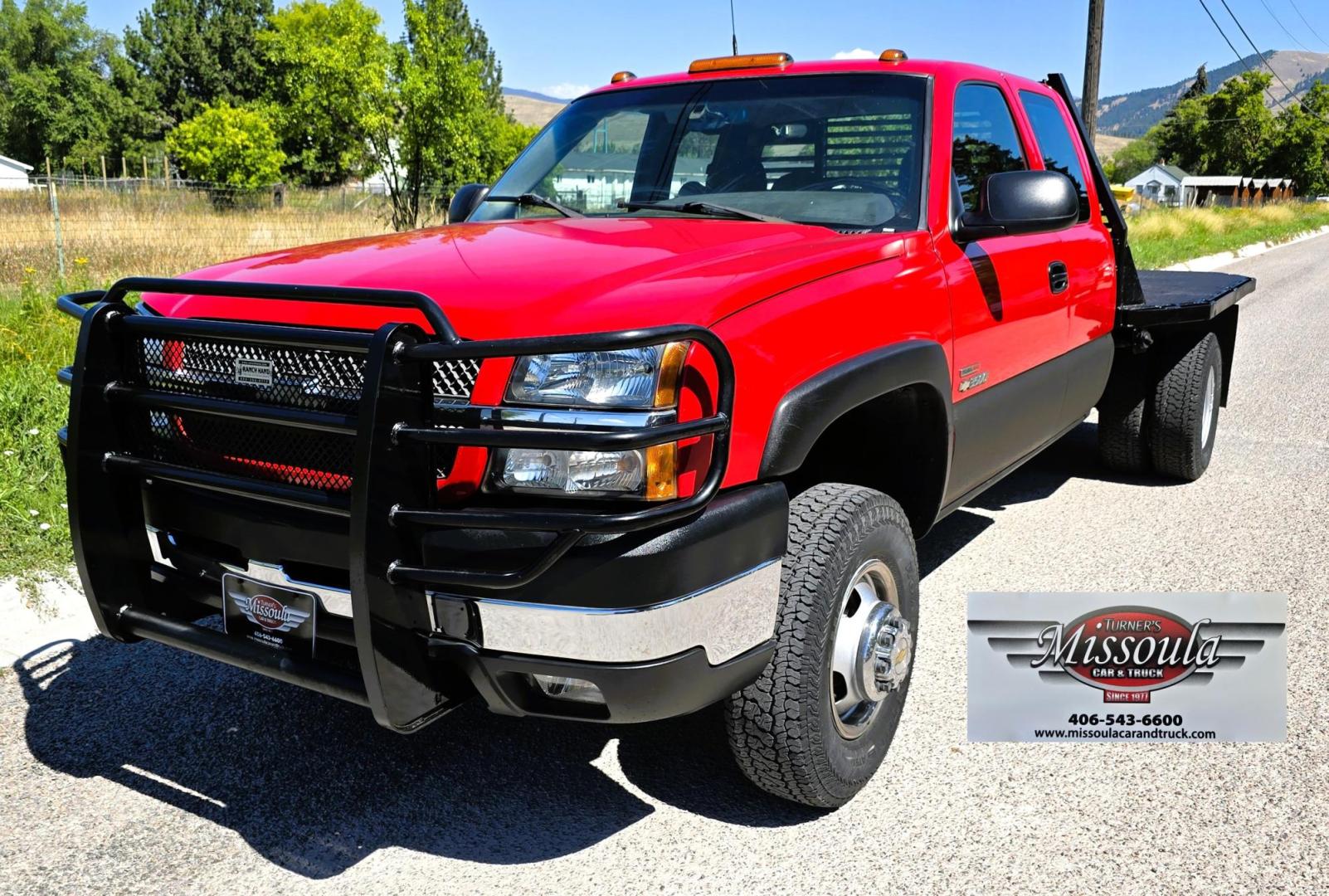 2004 Red /Gray Chevrolet Silverado 3500 Ext. Cab 4WD (1GCJK392X4E) with an 6.6L V8 OHV 32V TURBO DIESEL engine, 6 Speed Manual transmission, located at 450 N Russell, Missoula, MT, 59801, (406) 543-6600, 46.874496, -114.017433 - The Ultimate Unicorn of Chevy Trucks. One Ton Dually, Flatbed, 6.6L Duramax Diesel with a 6 Speed Manual Transmission. And Only 129K Miles! Tires are like New. Air. Cruise. Tilt. Power Windows and Locks. AM FM CD Player, Brush Guard. Headache Rack. Because of the age of this Vehicle, our lenders - Photo#6