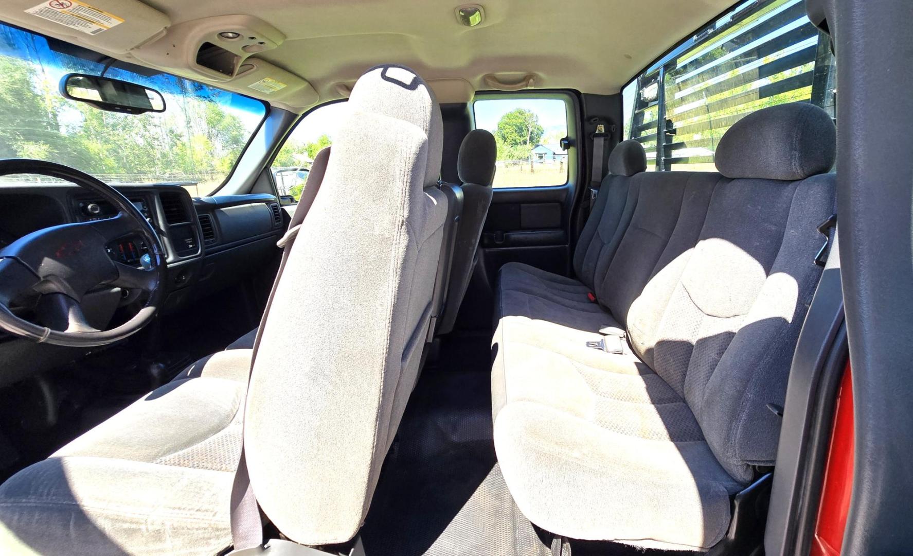 2004 Red /Gray Chevrolet Silverado 3500 Ext. Cab 4WD (1GCJK392X4E) with an 6.6L V8 OHV 32V TURBO DIESEL engine, 6 Speed Manual transmission, located at 450 N Russell, Missoula, MT, 59801, (406) 543-6600, 46.874496, -114.017433 - The Ultimate Unicorn of Chevy Trucks. One Ton Dually, Flatbed, 6.6L Duramax Diesel with a 6 Speed Manual Transmission. And Only 129K Miles! Tires are like New. Air. Cruise. Tilt. Power Windows and Locks. AM FM CD Player, Brush Guard. Headache Rack. Because of the age of this Vehicle, our lenders - Photo#13