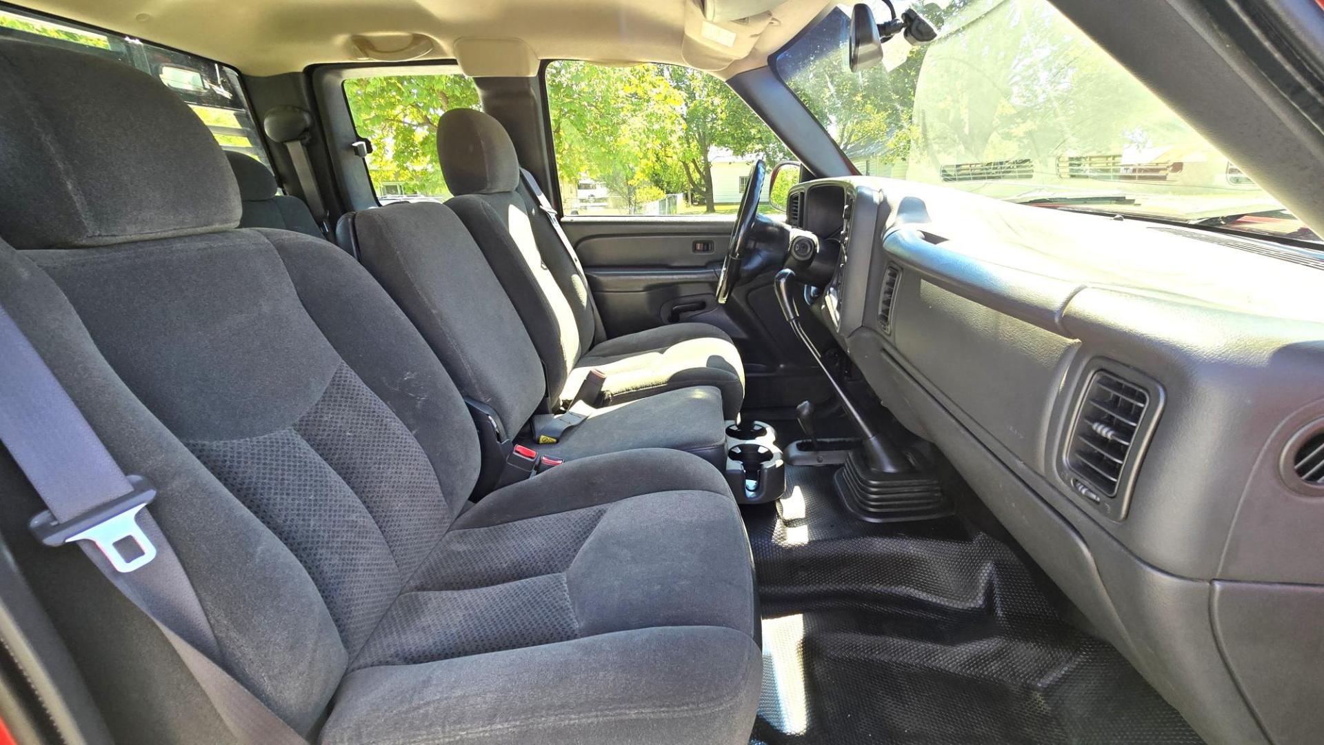 2004 Red /Gray Chevrolet Silverado 3500 Ext. Cab 4WD (1GCJK392X4E) with an 6.6L V8 OHV 32V TURBO DIESEL engine, 6 Speed Manual transmission, located at 450 N Russell, Missoula, MT, 59801, (406) 543-6600, 46.874496, -114.017433 - The Ultimate Unicorn of Chevy Trucks. One Ton Dually, Flatbed, 6.6L Duramax Diesel with a 6 Speed Manual Transmission. And Only 129K Miles! Tires are like New. Air. Cruise. Tilt. Power Windows and Locks. AM FM CD Player, Brush Guard. Headache Rack. Because of the age of this Vehicle, our lenders - Photo#14