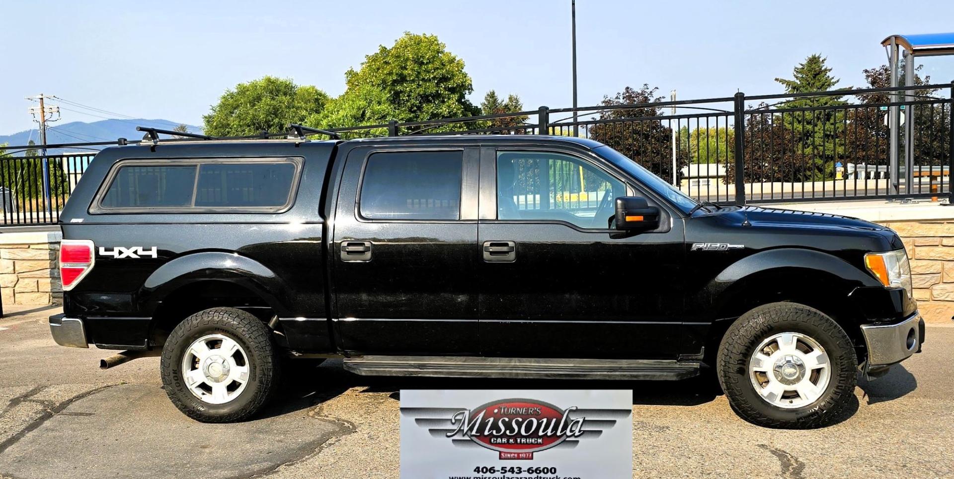 2013 Black /Gray Ford F-150 XLT SuperCrew 4WD (1FTFW1EF6DK) with an 5.0L V8 engine, 6-Speed Automatic transmission, located at 450 N Russell, Missoula, MT, 59801, (406) 543-6600, 46.874496, -114.017433 - High Miles but you wouldn't know it by how well this girl runs. 5.0L V8 Engine. 4WD.. Nice Matching Topper with Racks on top for your canoe. Air. Cruise. Tilt. Power Windows and Locks. Bluetooth Audio and Phone. AM FM XM CD Player. Power Drivers Seat. Excellent Fuel Economy for a V8 Engine. Running - Photo#0