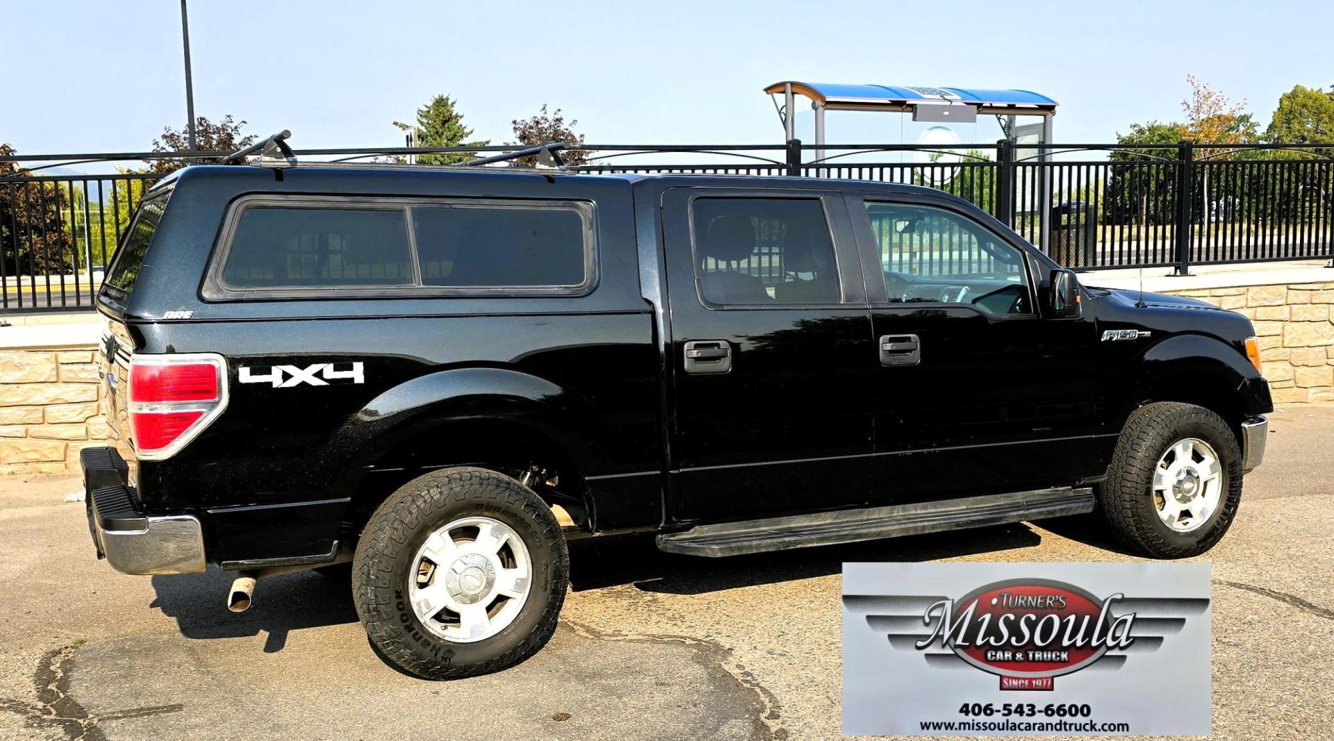 2013 Black /Gray Ford F-150 XLT SuperCrew 4WD (1FTFW1EF6DK) with an 5.0L V8 engine, 6-Speed Automatic transmission, located at 450 N Russell, Missoula, MT, 59801, (406) 543-6600, 46.874496, -114.017433 - High Miles but you wouldn't know it by how well this girl runs. 5.0L V8 Engine. 4WD.. Nice Matching Topper with Racks on top for your canoe. Air. Cruise. Tilt. Power Windows and Locks. Bluetooth Audio and Phone. AM FM XM CD Player. Power Drivers Seat. Excellent Fuel Economy for a V8 Engine. Running - Photo#1